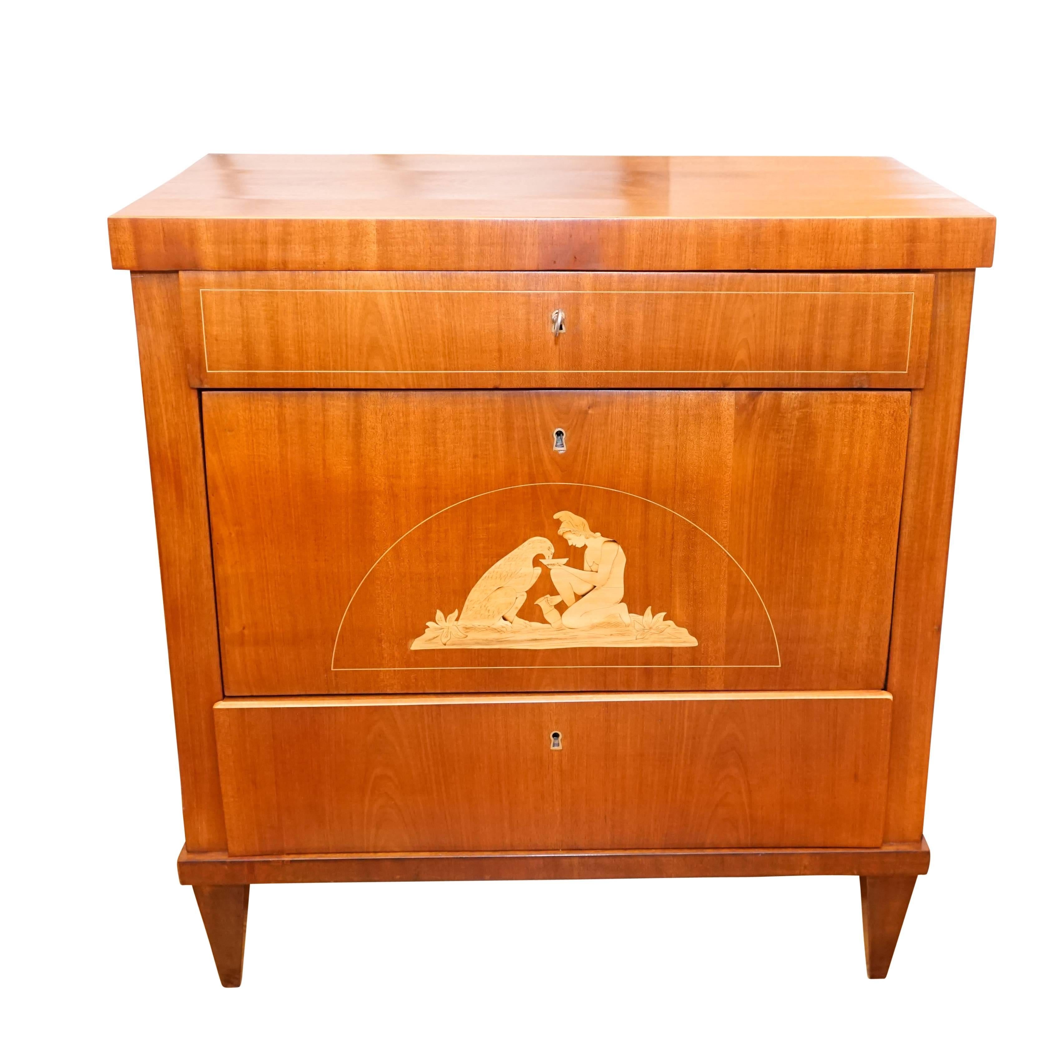 A petite chest of drawers, crafted of solid mahogany and fir, the piece is veneered with light mahogany with birch banding and marquetry. Bone escutcheons line the keyholes. The locks and keys are functioning and original.

This piece depicts the