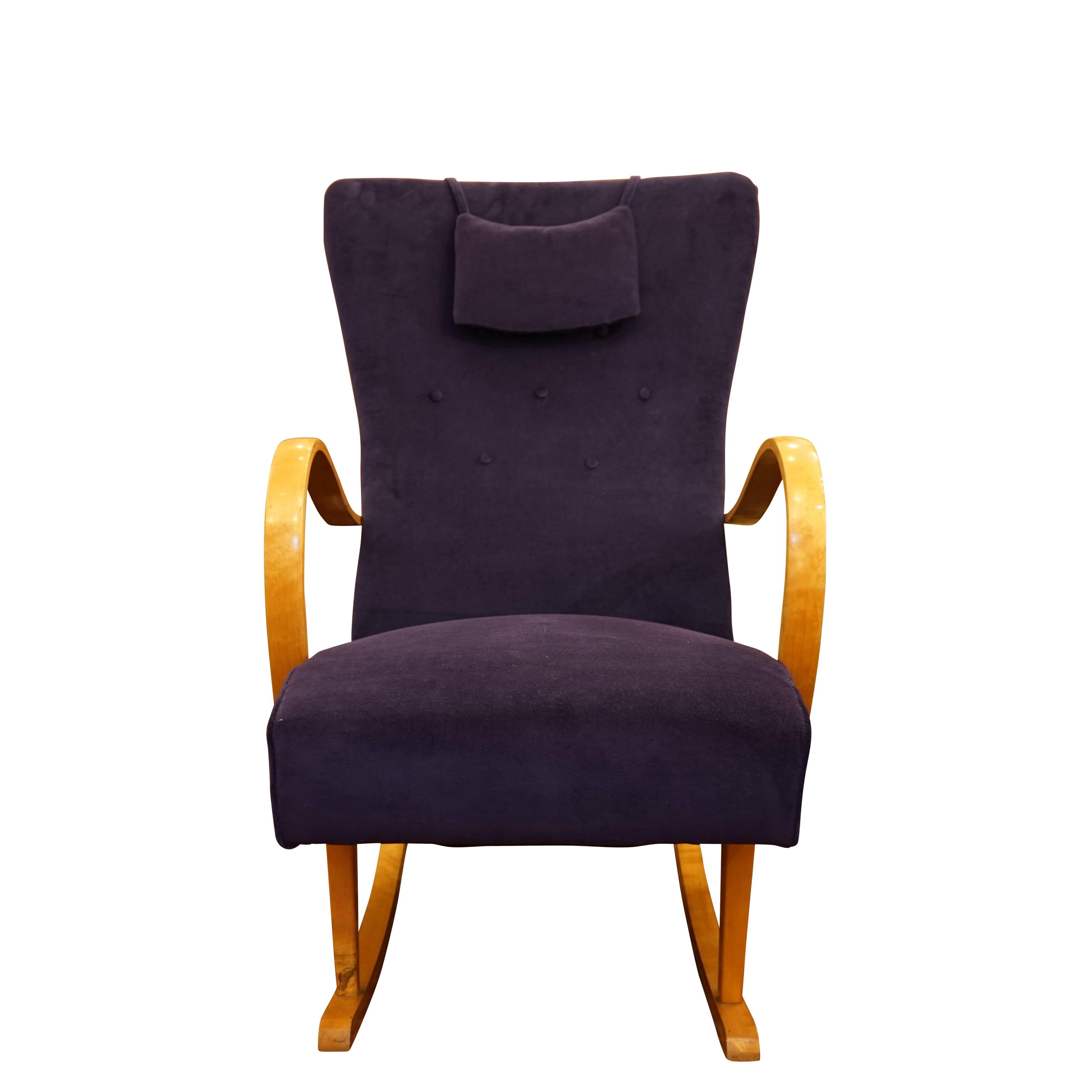 Crafted of solid birch and recently reupholstered in a lush purple velvet, the sprung seat, contoured back and attached head pillow offer exceptional comfort.