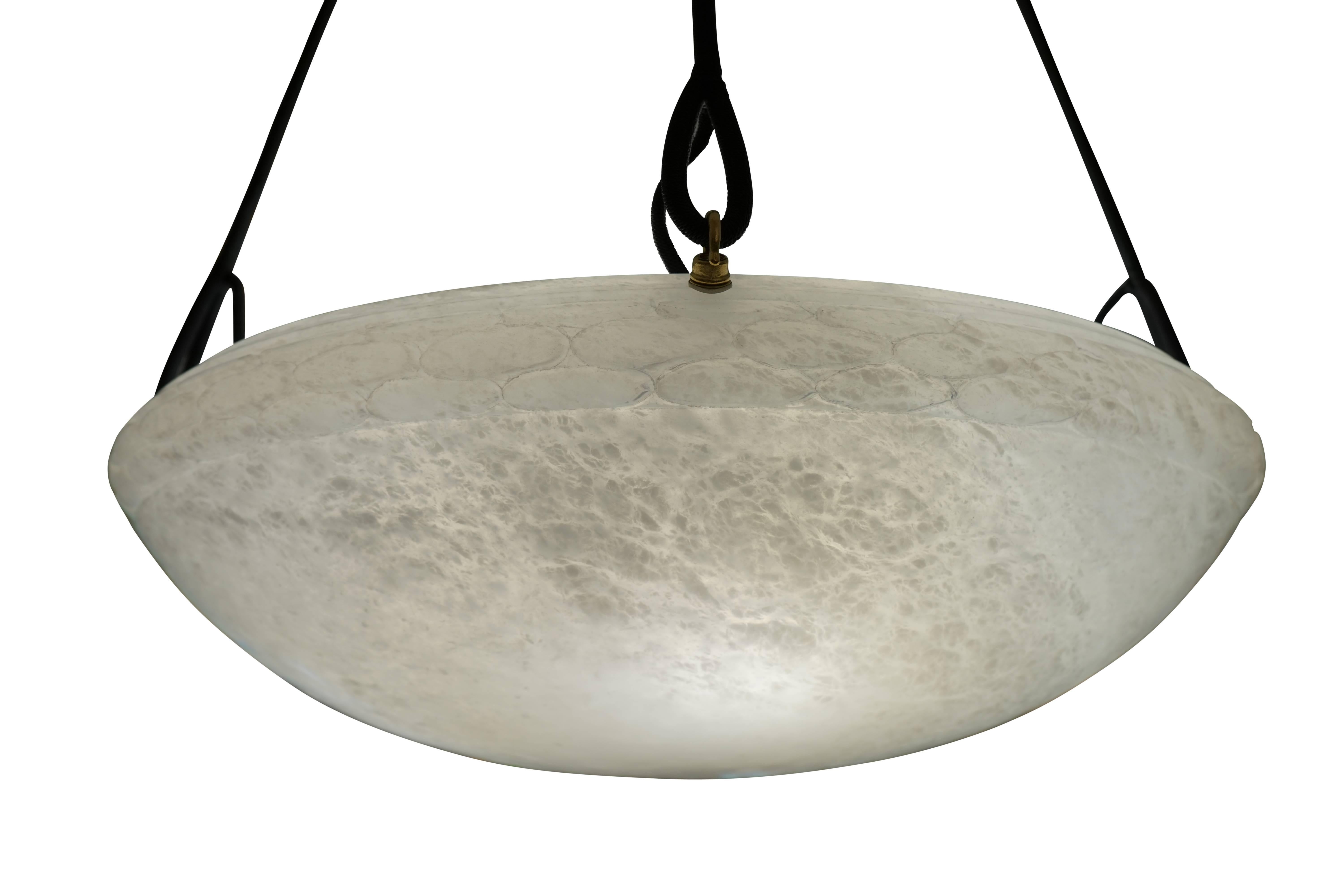 Large and lovely, this pendant features a thigh laurel wreath which surrounds the upper edge of both the fixture itself, and its matching canopy. Recently rewired and suspended on four electrified ropes, the light holds four 60 watt incandescent