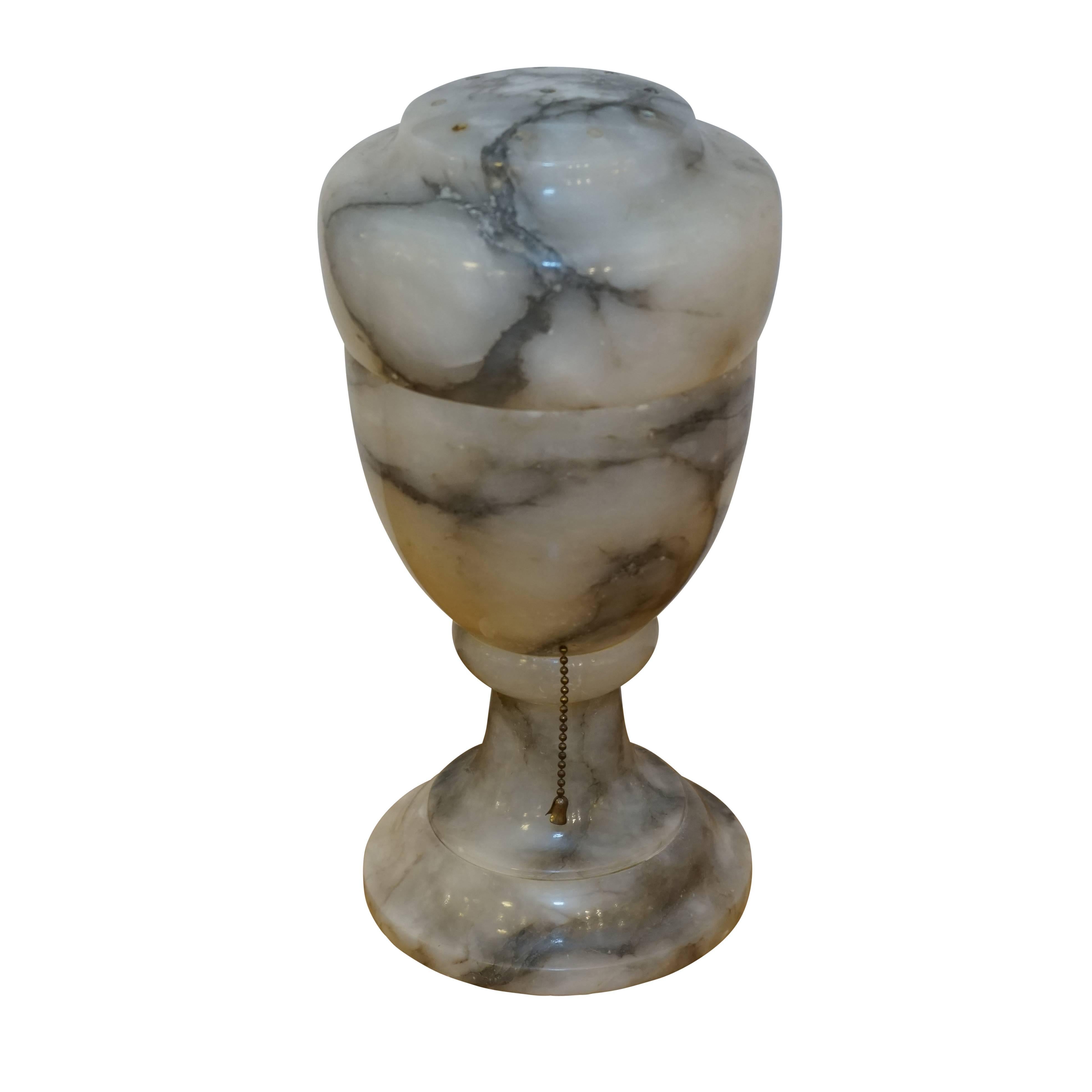 An illuminated urn, this lamp provides soft mood lighting for a dark evening. Tiny ventilation holes on the lid allow the heat of an incandescent bulb to rise and vent. Alternately, a cool LED bulb is also suggested for even brighter light!
