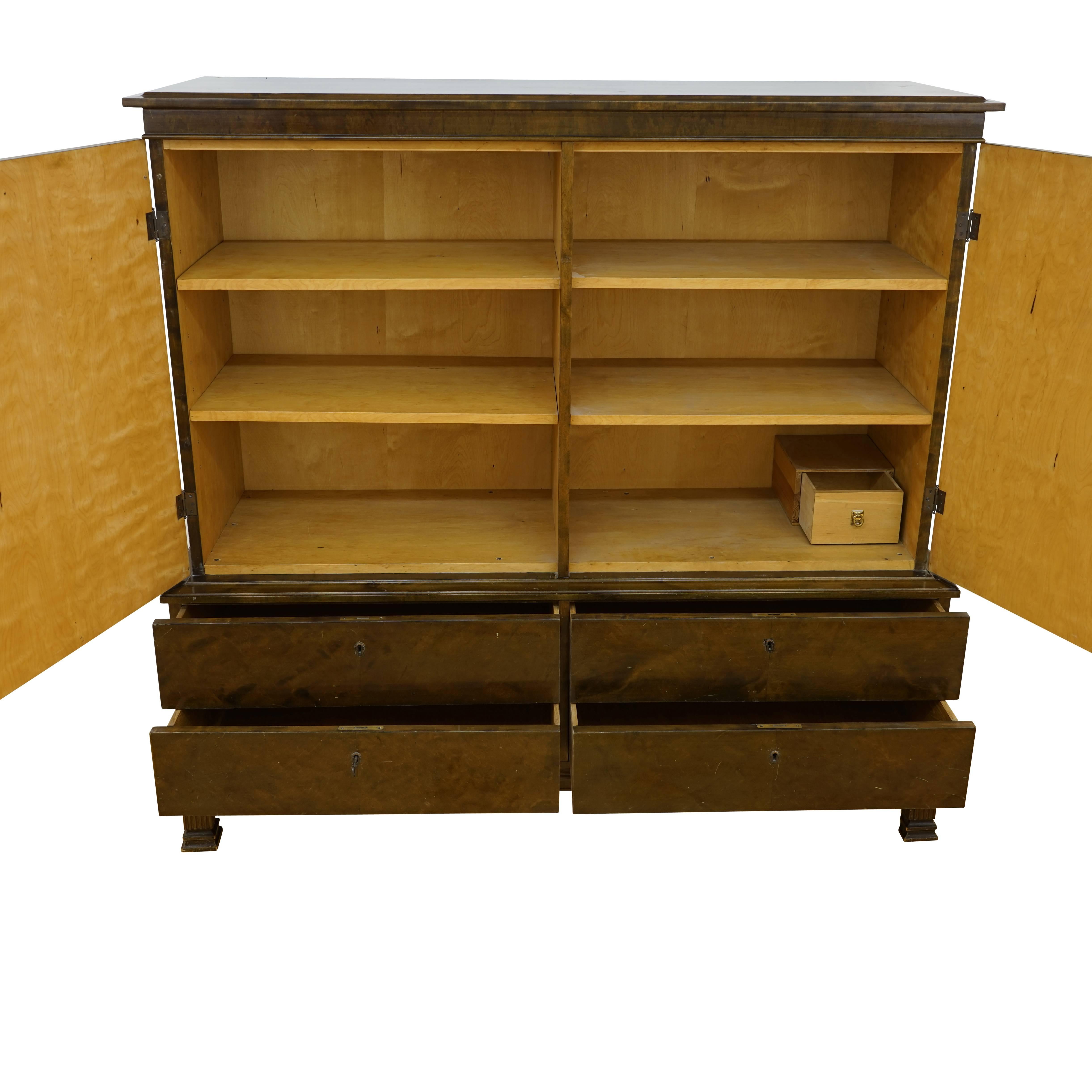 Need storage? Then this stately, geometric cabinet might be just what you desire. Four solid, sturdy shelves, originally used to store heavy and valuable china and crystal, divide the upper section. An integral inner drawer hides in the rear of the