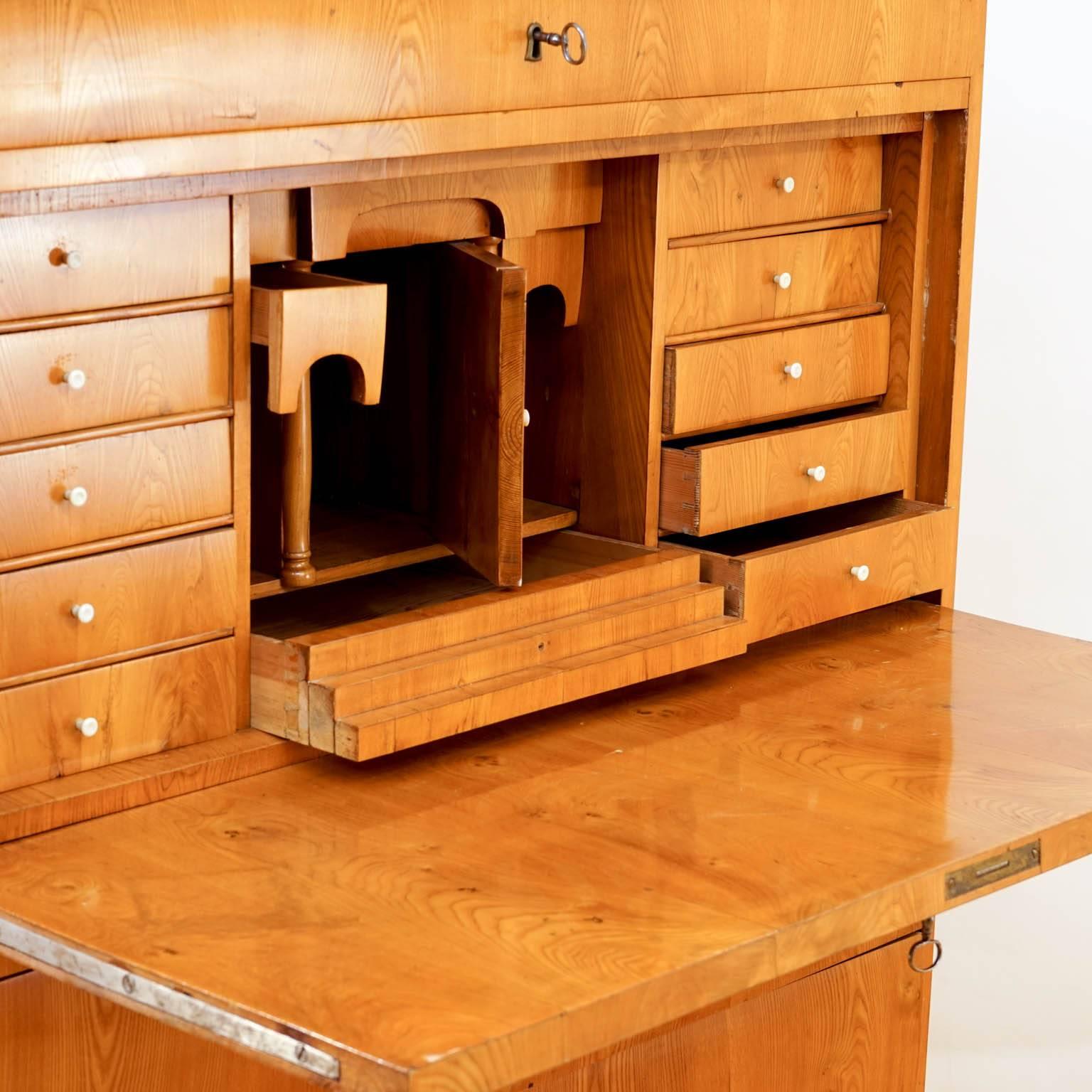 A strong, elegant piece to keep you perfectly organized! Crafted of hand-hewn fir and ash and veneered with thick hand-cut ash veneers, this chest offers storage for everything. A long, locking upper drawer rests above a fall-front inner compartment