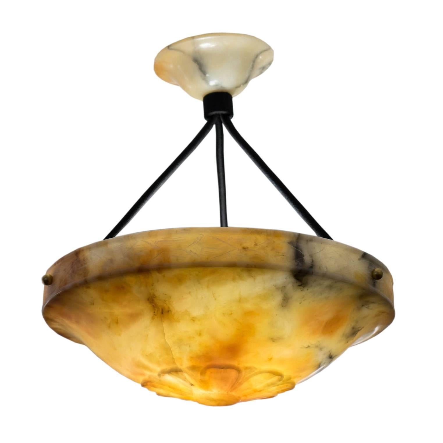 This jewel of a fixture dresses up any small space with classic elegance. A hard edged double-banded rim rests above a curved bowl with a fleurette gracing the center. Recently rewired to a short overall drop on black electrified cords, using the