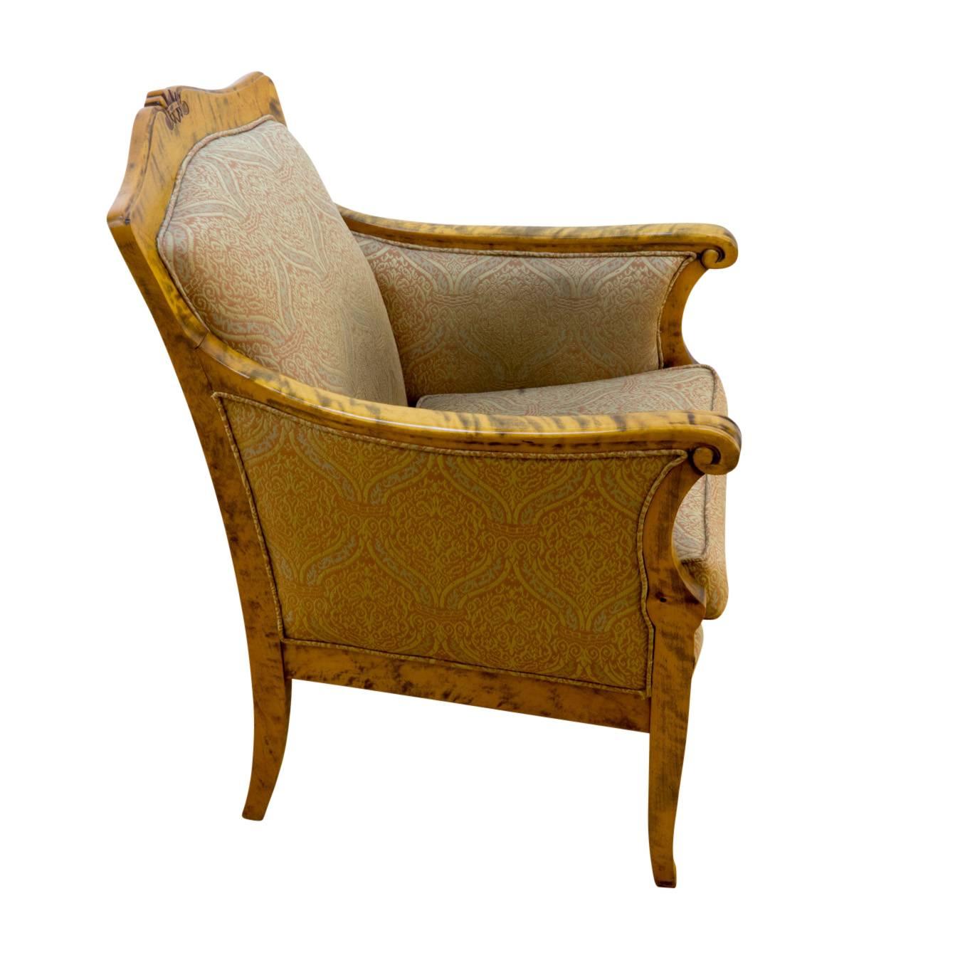 Designed for a graceful 19th century sitting room, this chair is constructed of solid highly figured birch, and reupholstered in a period appropriate, but modern fabric. The addition of a seat cushion at the time of reupholster, adds seat height as