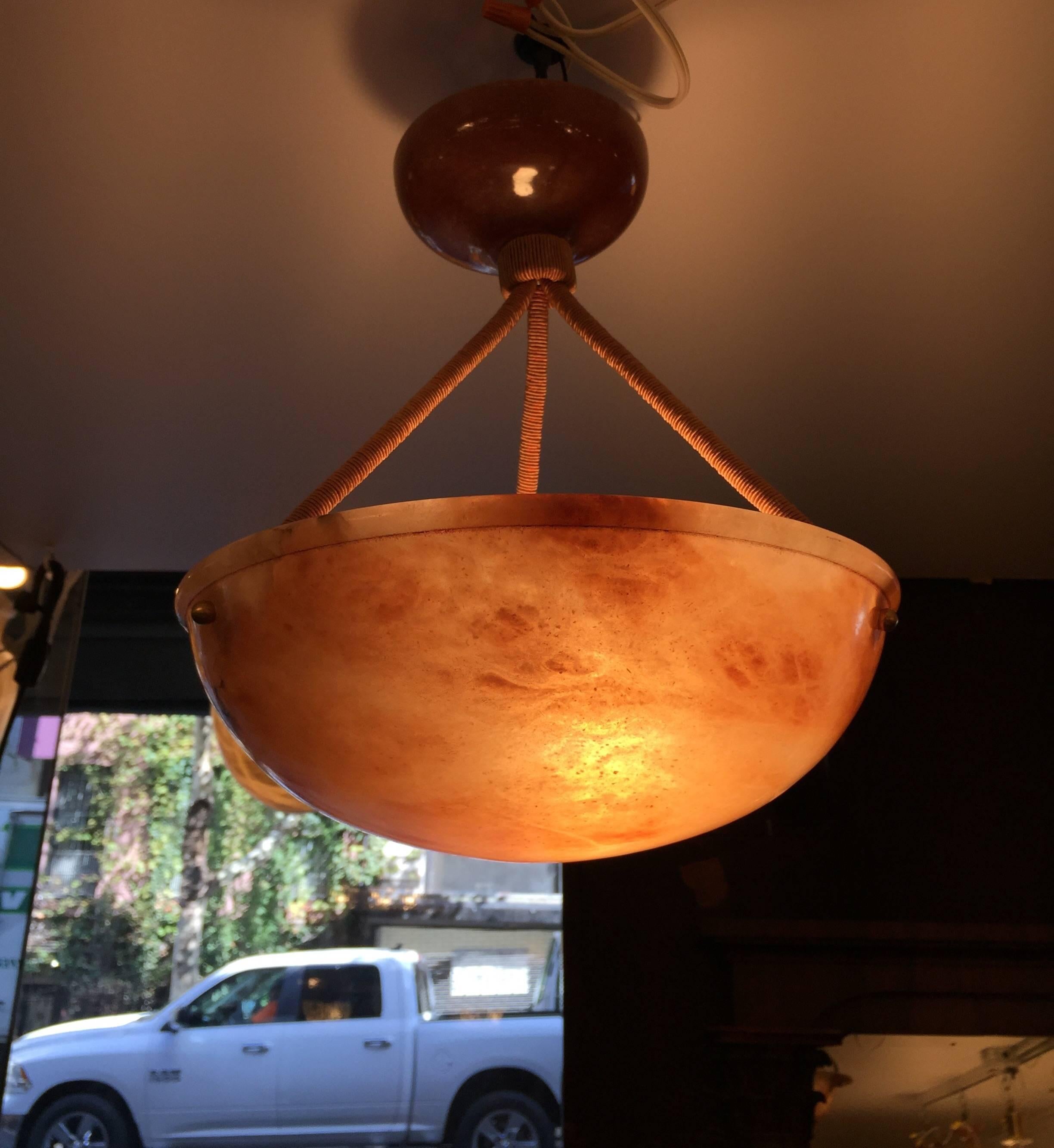 This beautiful example of Art Deco decorative alabaster lighting is a set of two that have been recently rewired for the U.S. market. At 12 inches in diameter each they are a perfect pair for a hallway or transitional space that needs light. Each
