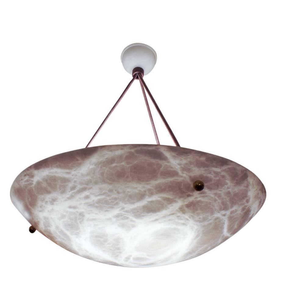 While the early Art Deco furnishings from the 1920s were decorative, the later 1930s Art Deco was all about geometry. Hence this sleek white alabaster fixture with matching alabaster canopy, adorned simply, with three brass balls. Custom roping and