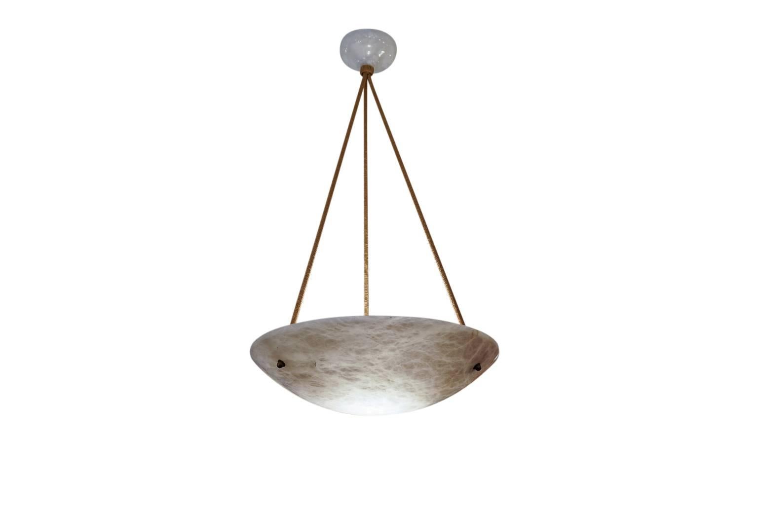 Geometry is the name of this game, as the dappled white alabaster softly reflects the light of three dimmable, 100 watt LED bulbs onto the matching sleek alabaster canopy. The current overall drop of 36