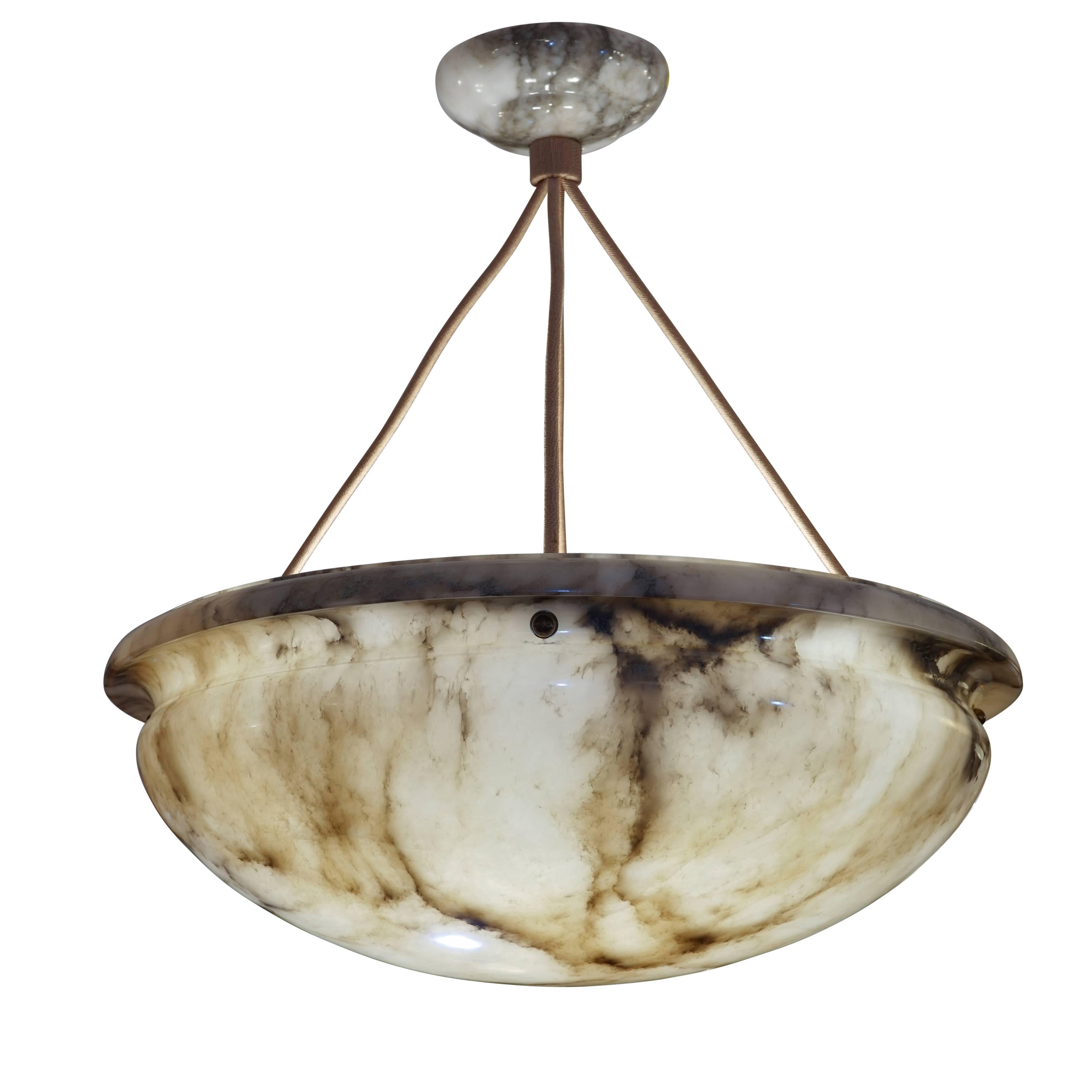 Seriously beautiful, this large and deep pendant features moody and distinctive charcoal mineral veining softened by a generously out-turned upper lip.  The alabaster canopy is carved from the same deeply veined alabaster.  Recently rewired to US