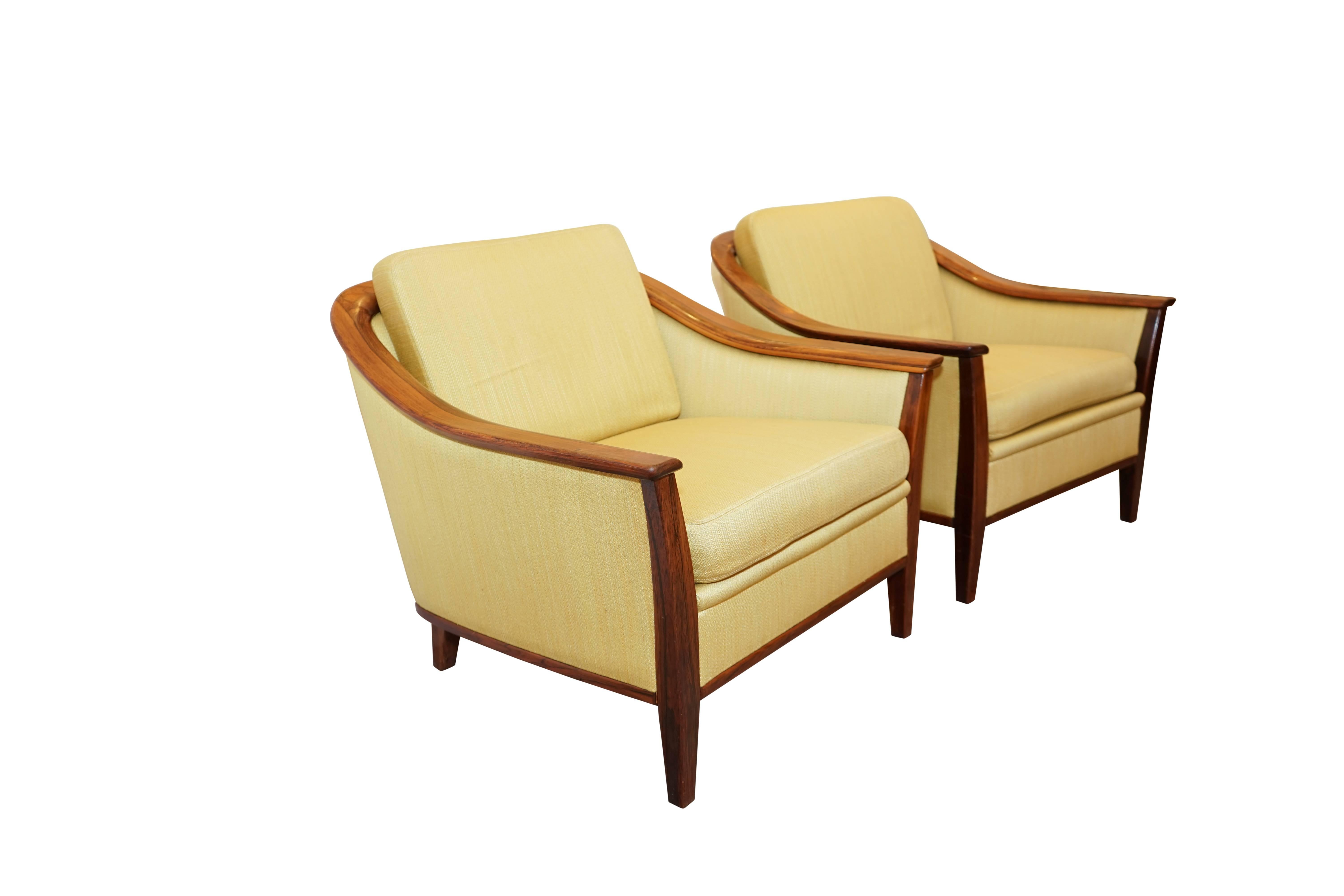 Sleekly Swedish, this ensemble is as comfortable as it is beautiful. Framed in solid jacaranda and bearing the original honey toned upholstery, the set is also offered as a pair of chairs or the sofa independently. Please contact us for separate