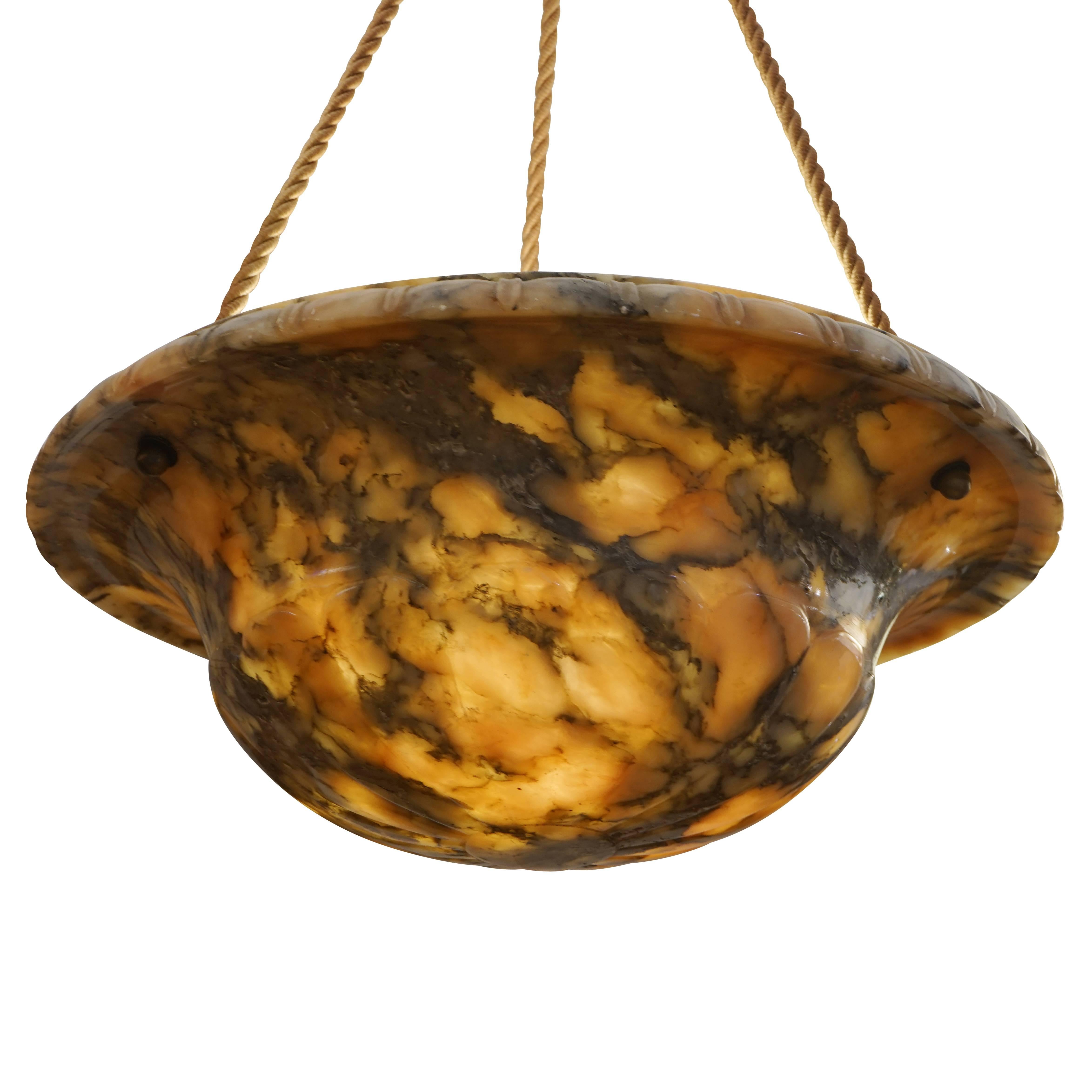Highly figured alabaster stone with matching canopy and braided electrified cords. Features three lightbulbs.

Dimensions: 16