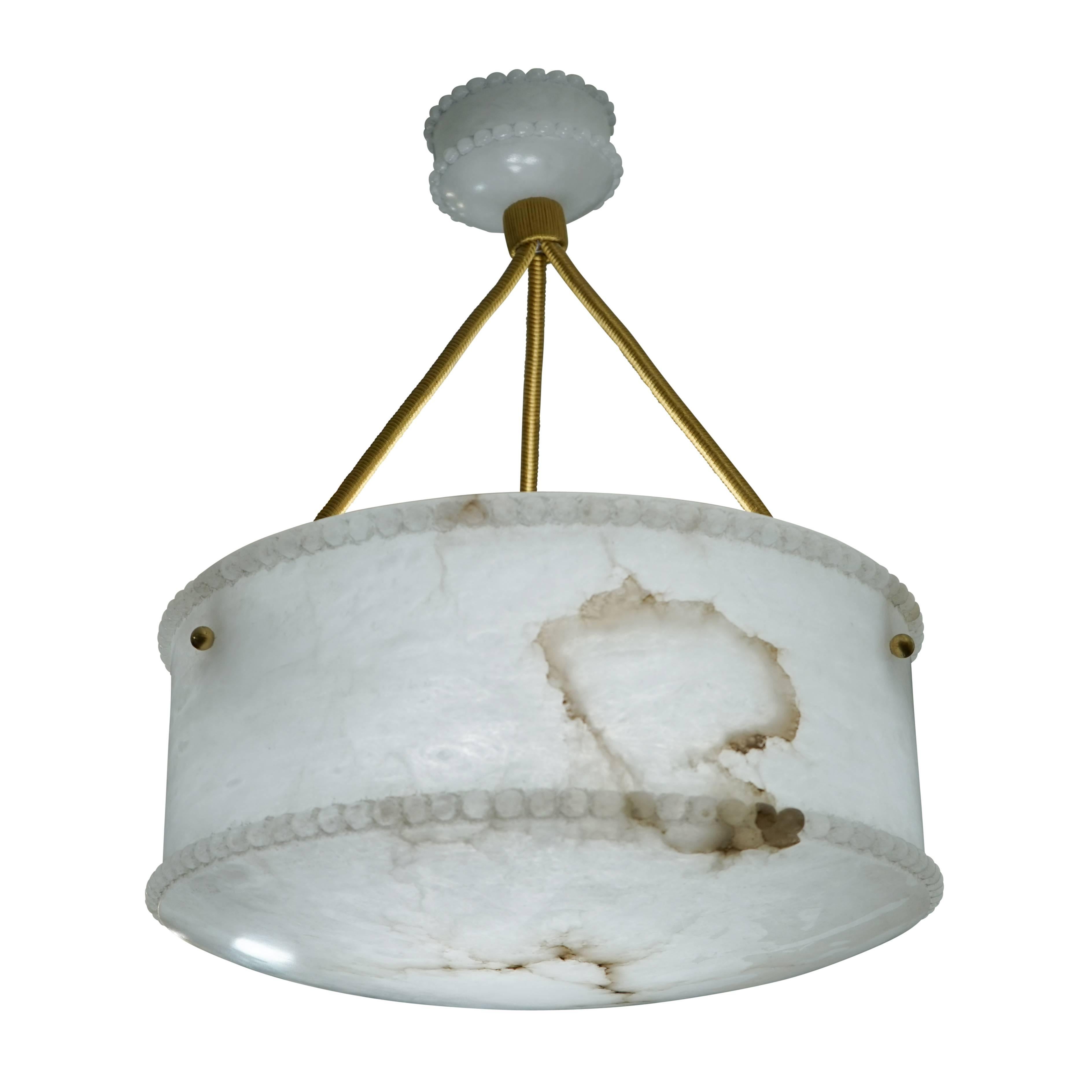 Recently rewired, this deep, lightly veined fixture has upper and lower rims decorated with beading, a matching alabaster canopy and holds three sockets of any wattage LED bulbs. Priced individually, this fixture is also available as part of a set