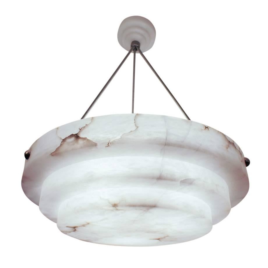Think of a wedding cake, turned upside down! This pure white alabaster is whimsical, balanced, and from the early Art Deco period of Sweden, where alabaster supplies were scarce after the First World War. Recently rewired to hold three LED bulbs of