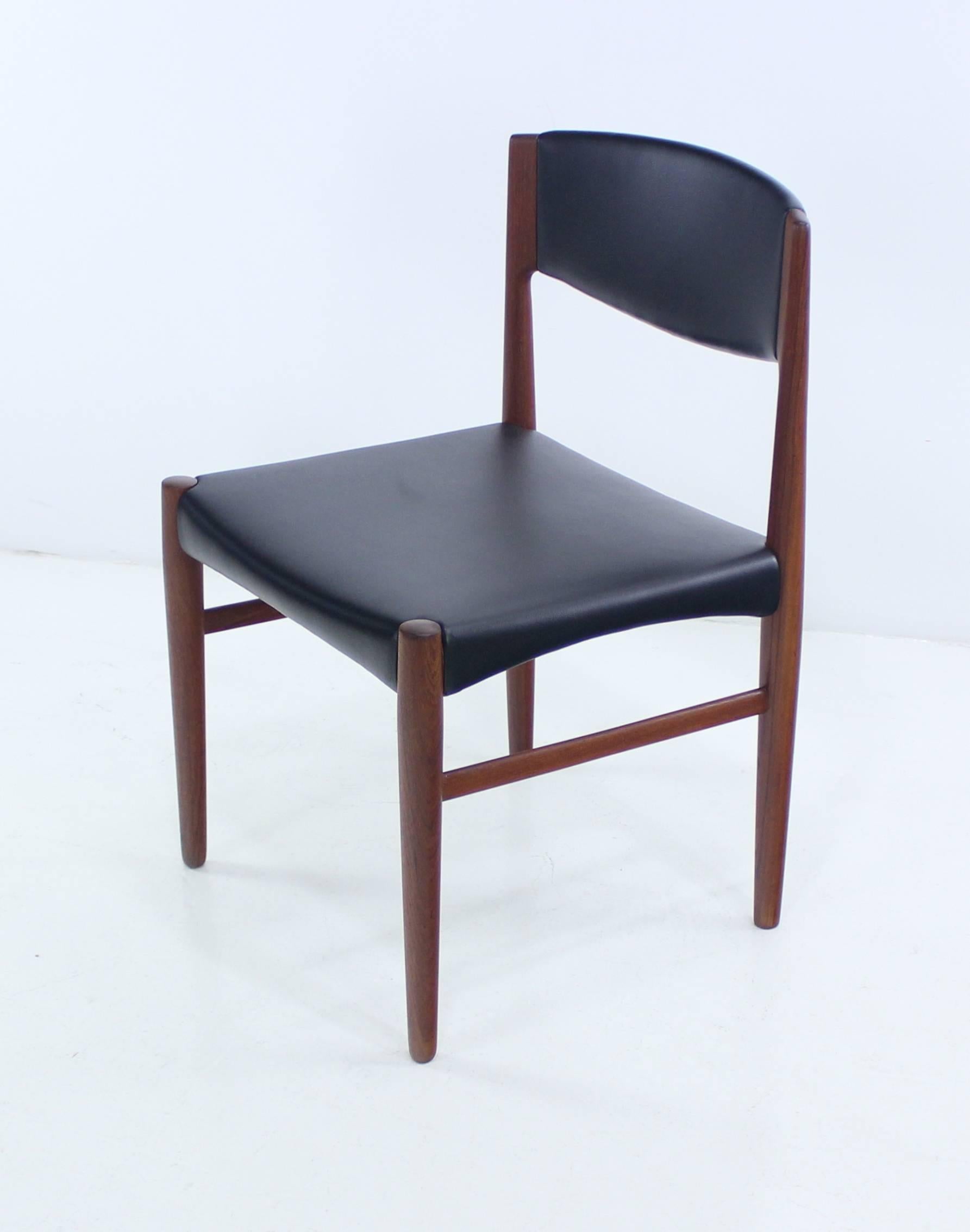 Six Danish modern dining chairs. Glostrup Mobelfabrik, maker.
Rich, dark teak frames.
Curved backs and seats newly upholstered in highest quality black leatherette.
Professionally restored and refinished by LookModern.
Matchless quality and