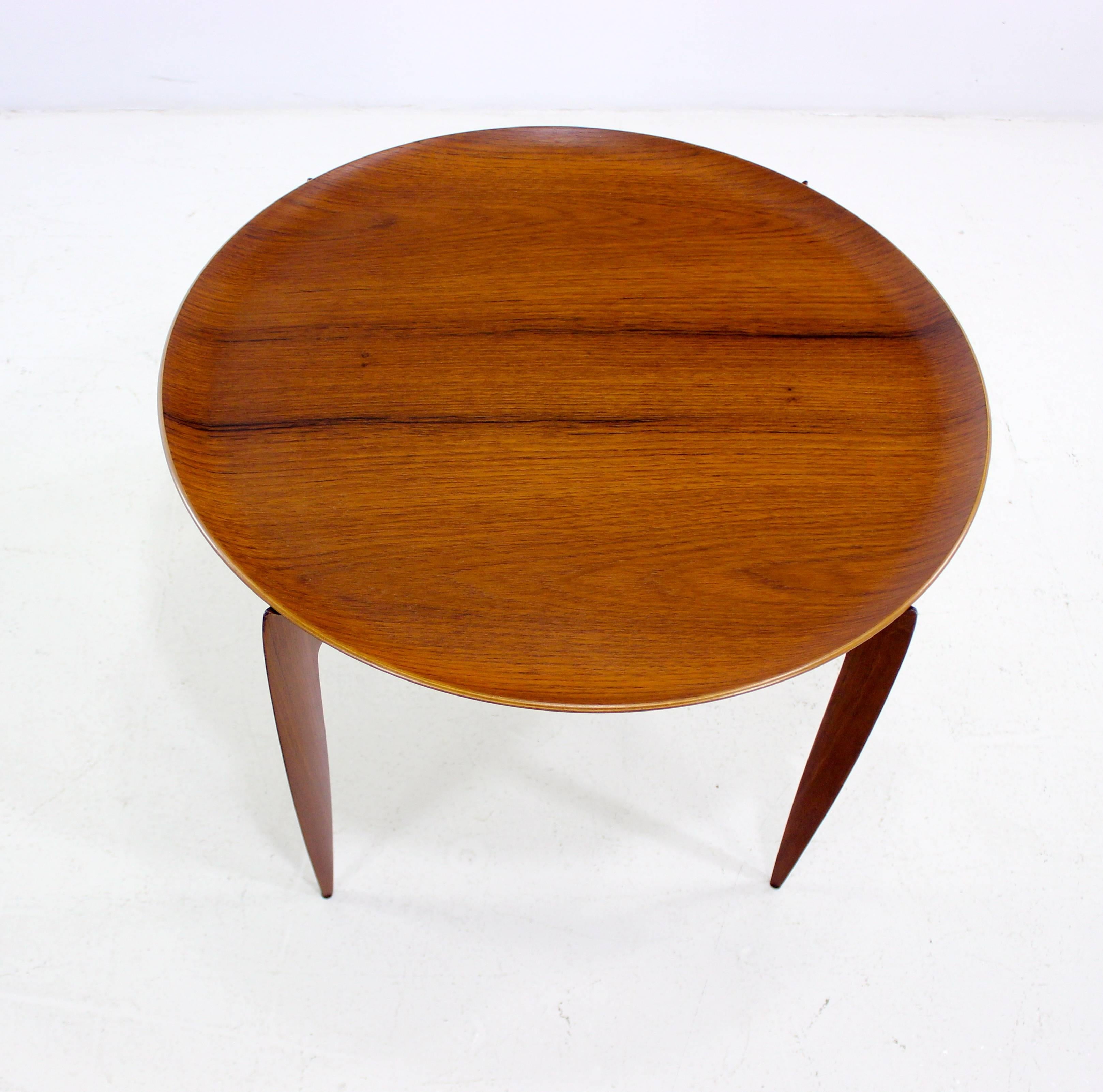 Danish modern tray table designed by H. Engholm and Svend Aage Willumsen. Fritz Hansen, maker.
Removable teak tray measuring 23.5
