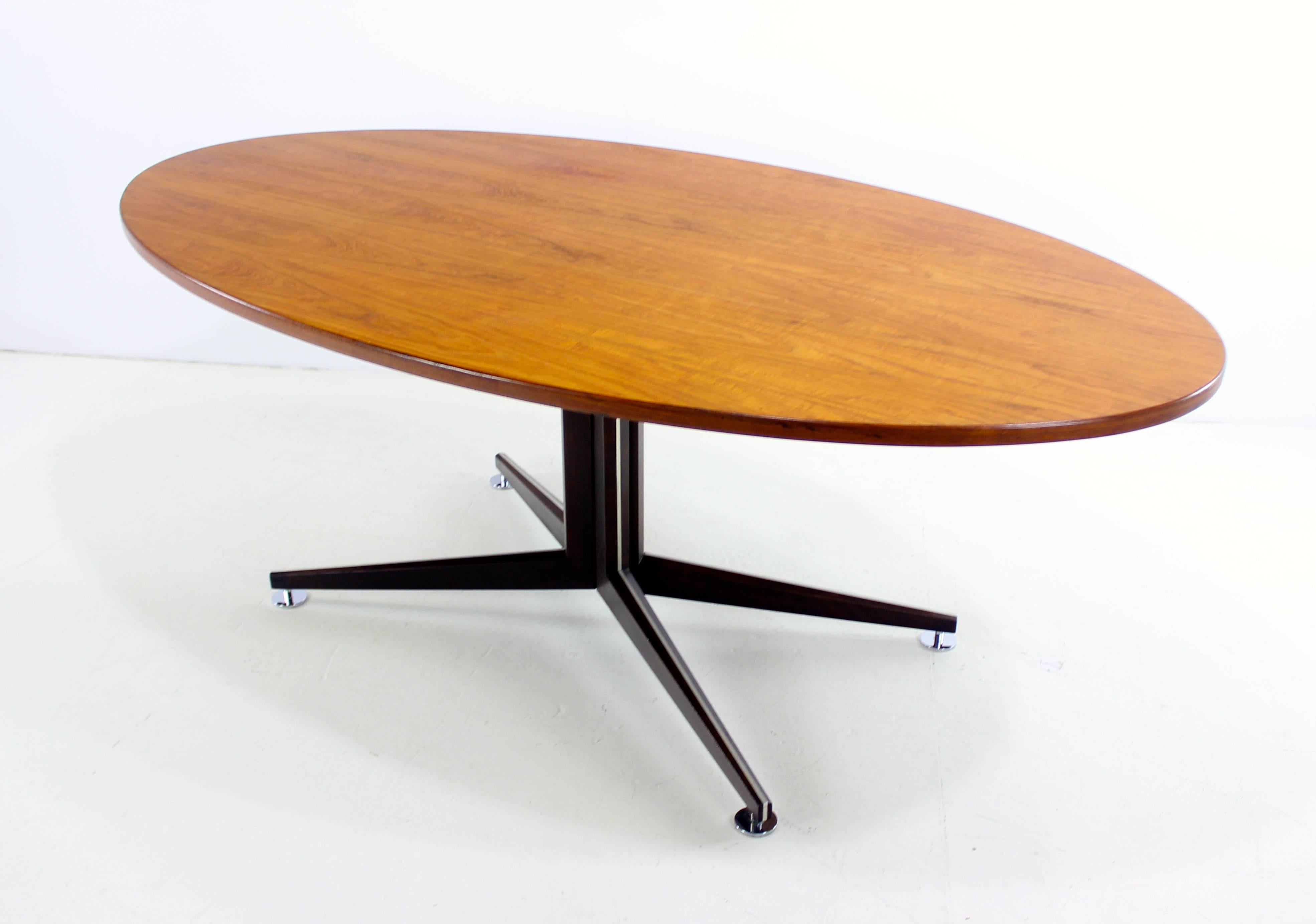 Mid-Century Modern dining table designed by Edward Wormley for Dunbar.
Richly grained oval teak top. 
Pedestal base is dark walnut with metal inlay.
Professionally restored and refinished by LookModern.
Matchless quality and price.
Low freight