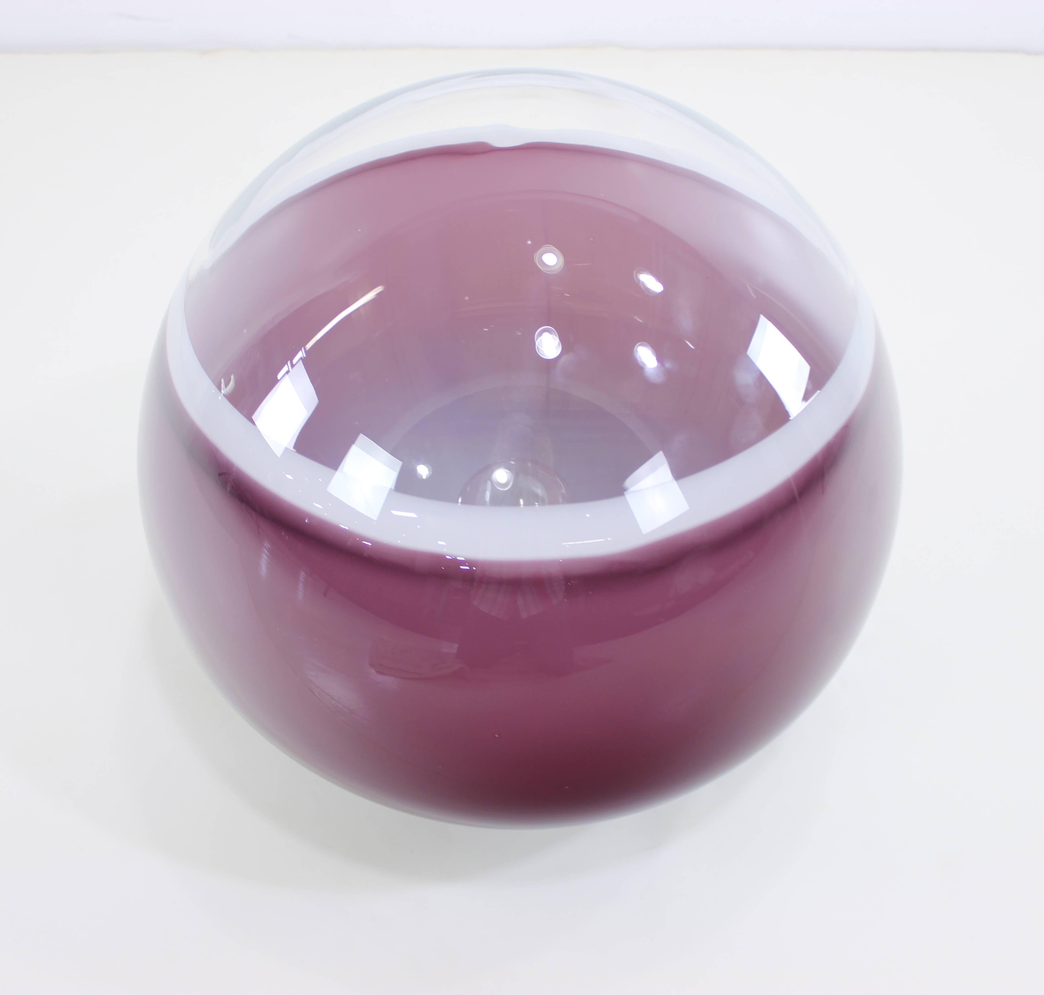 Rare Murano glass lamp by Alfredo Barbini.
Handblown glass with impressive 18" diameter.
Lush mauve color with rich, ambient glow.
Brushed aluminum base.
Accommodates one medium base bulb.
Matchless quality and price.
Low freight and
