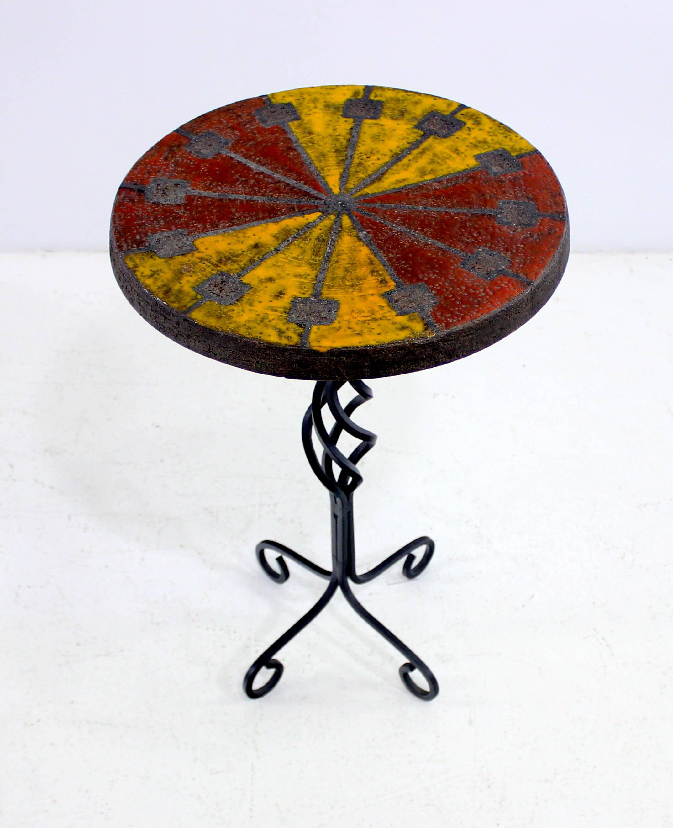 Mid-Century Italian modern by Raymor.
Handcrafted wrought iron base with hand-painted ceramic tile top.
The ultimate jewel of a table, perfect for accessorizing any space.
Matchless quality and price.
Low freight, quick ship.
 