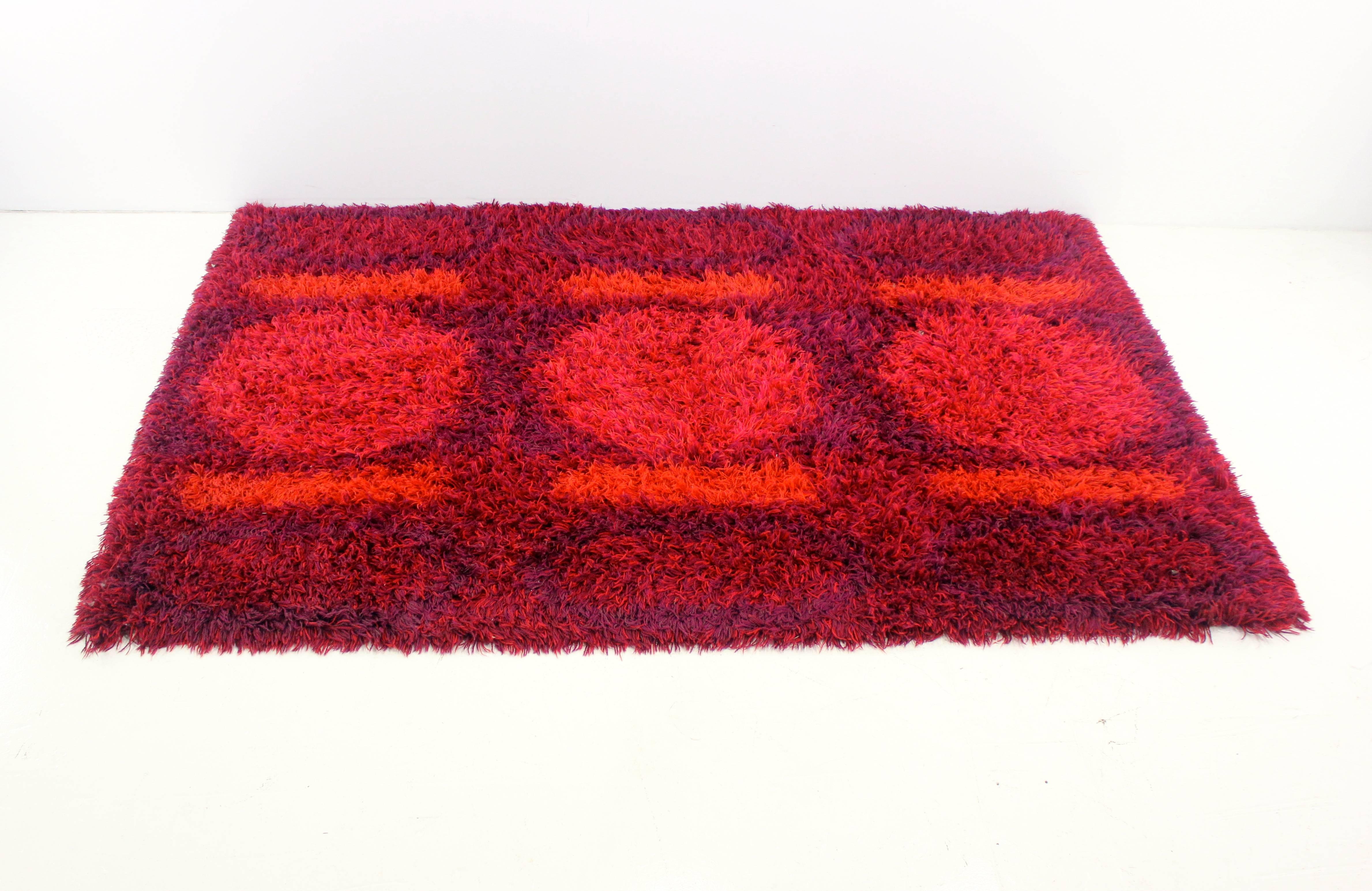 Danish modern Rya rug.
Bold, geometric pattern with saturated colors of burgundy, purple, orange and red.
100% wool with deep NAP.
Matchless quality and price.
Low freight, quick ship.

 