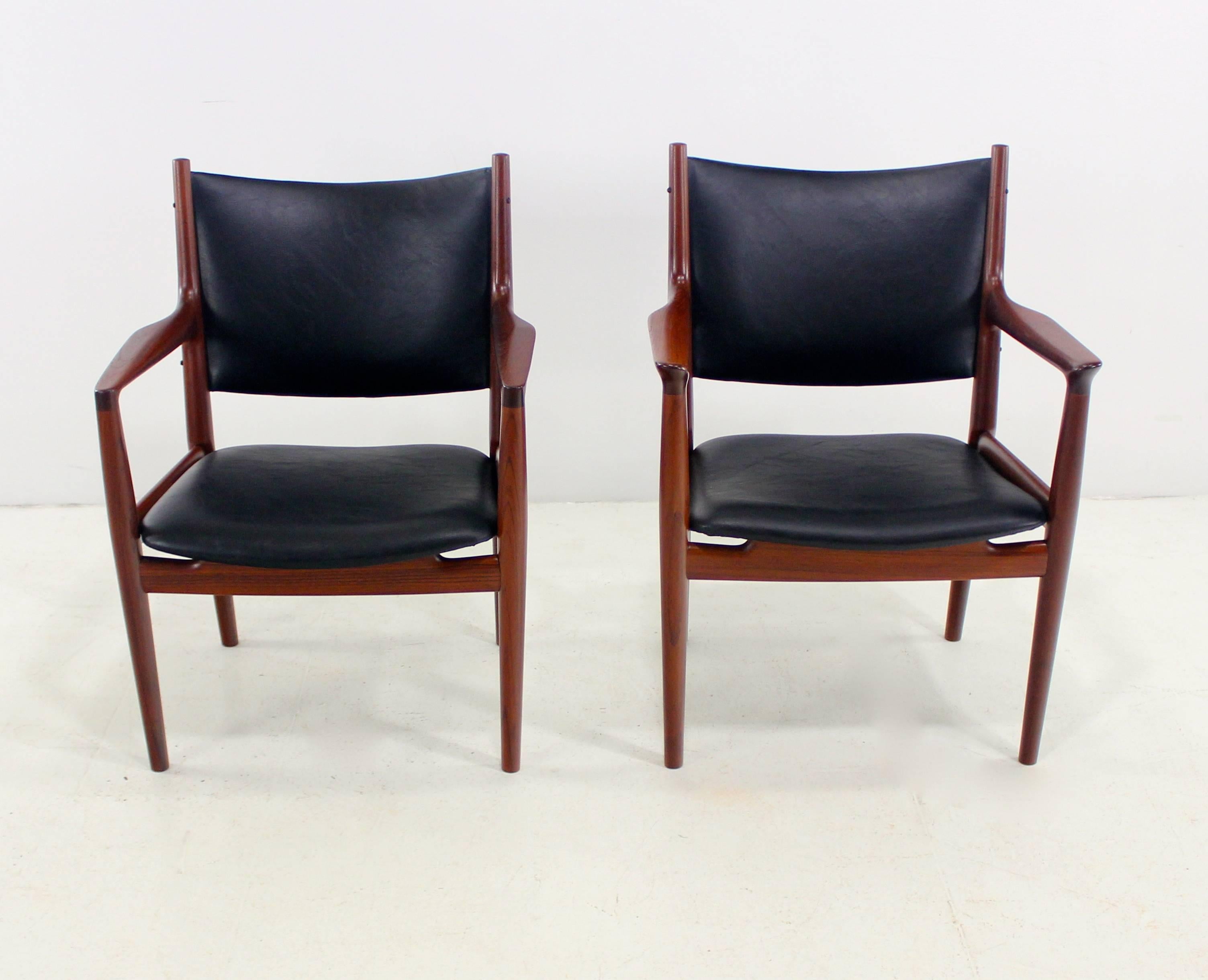 Illusive Danish modern papa & mama sized armchairs designed by Hans Wegner.
Johannes Hansen, maker. Model JH713.
Richly grained teak frames.
Seats and backs newly upholstered in highest quality Industrial grade leather backed vinyl.
Papa chair