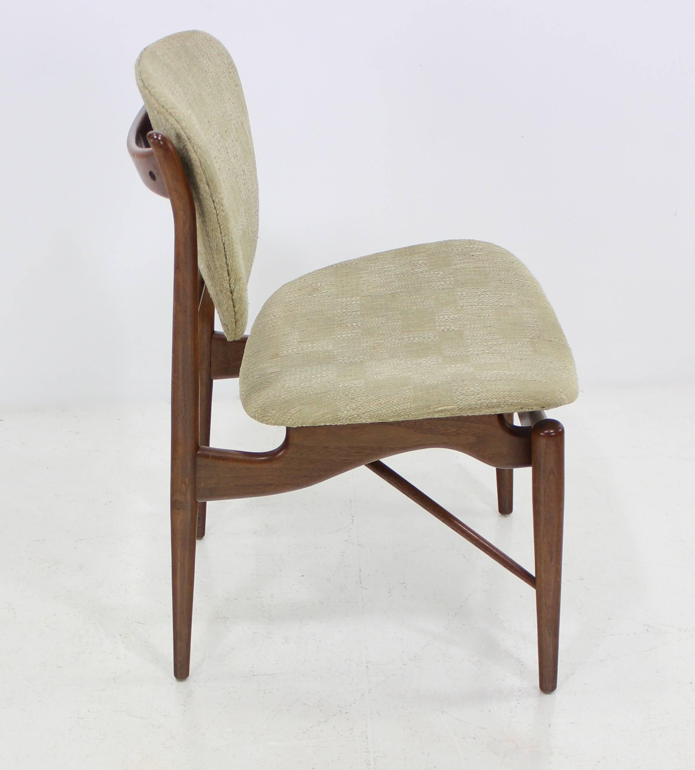 Five Danish modern dining chairs designed by Finn Juhl. 
Baker, maker.
Beautifully crafted teak frames with original upholstery.
As found condition.
Matchless quality and price. 
Low freight, quick ship. 

        