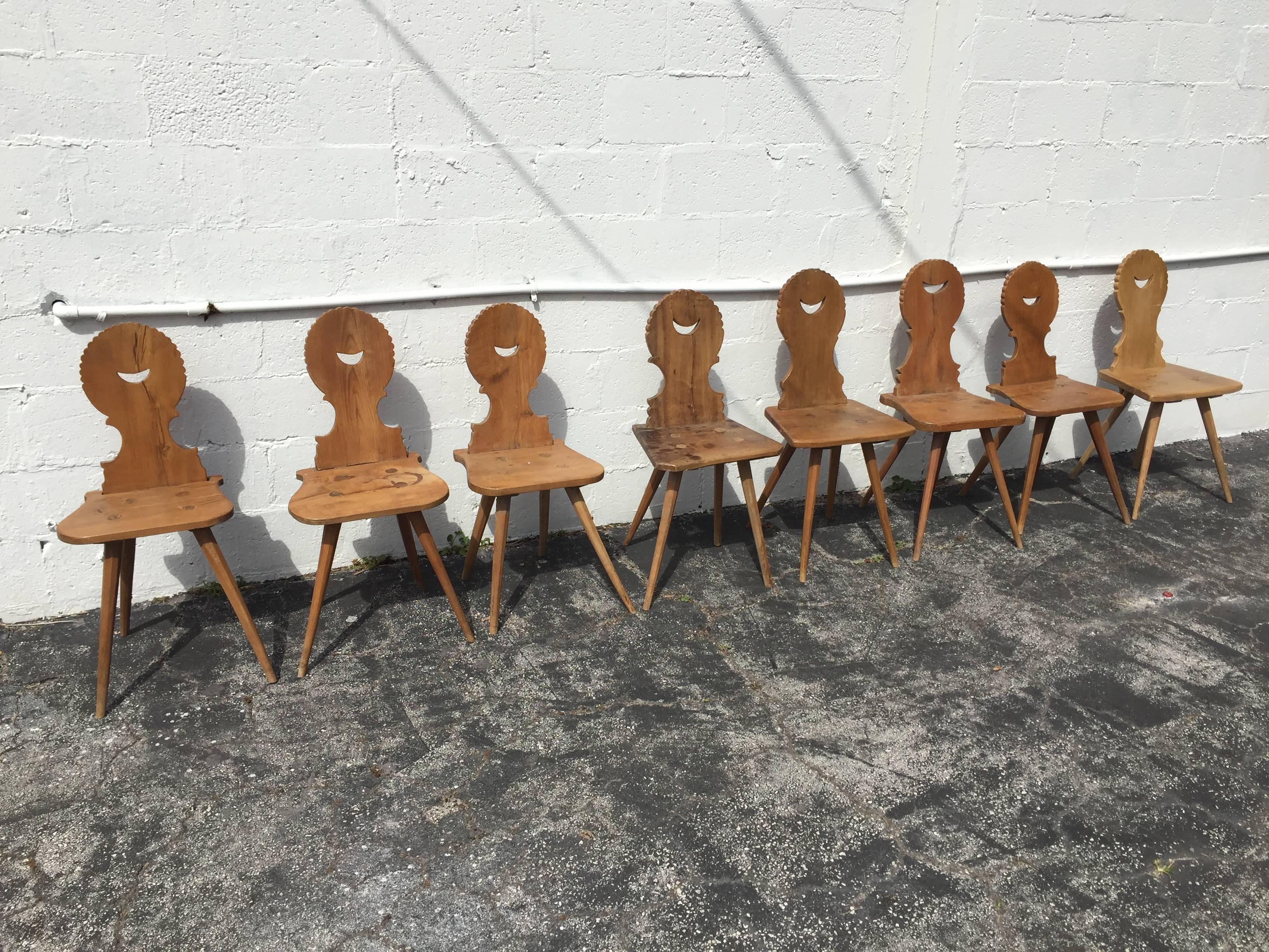 Delightful set of handmade mortise and tenon joint pine chairs. Although these chairs are a matching set, there are slight variances in sizes because of the handcrafted design. The chairs do show wear consistent with age and use.