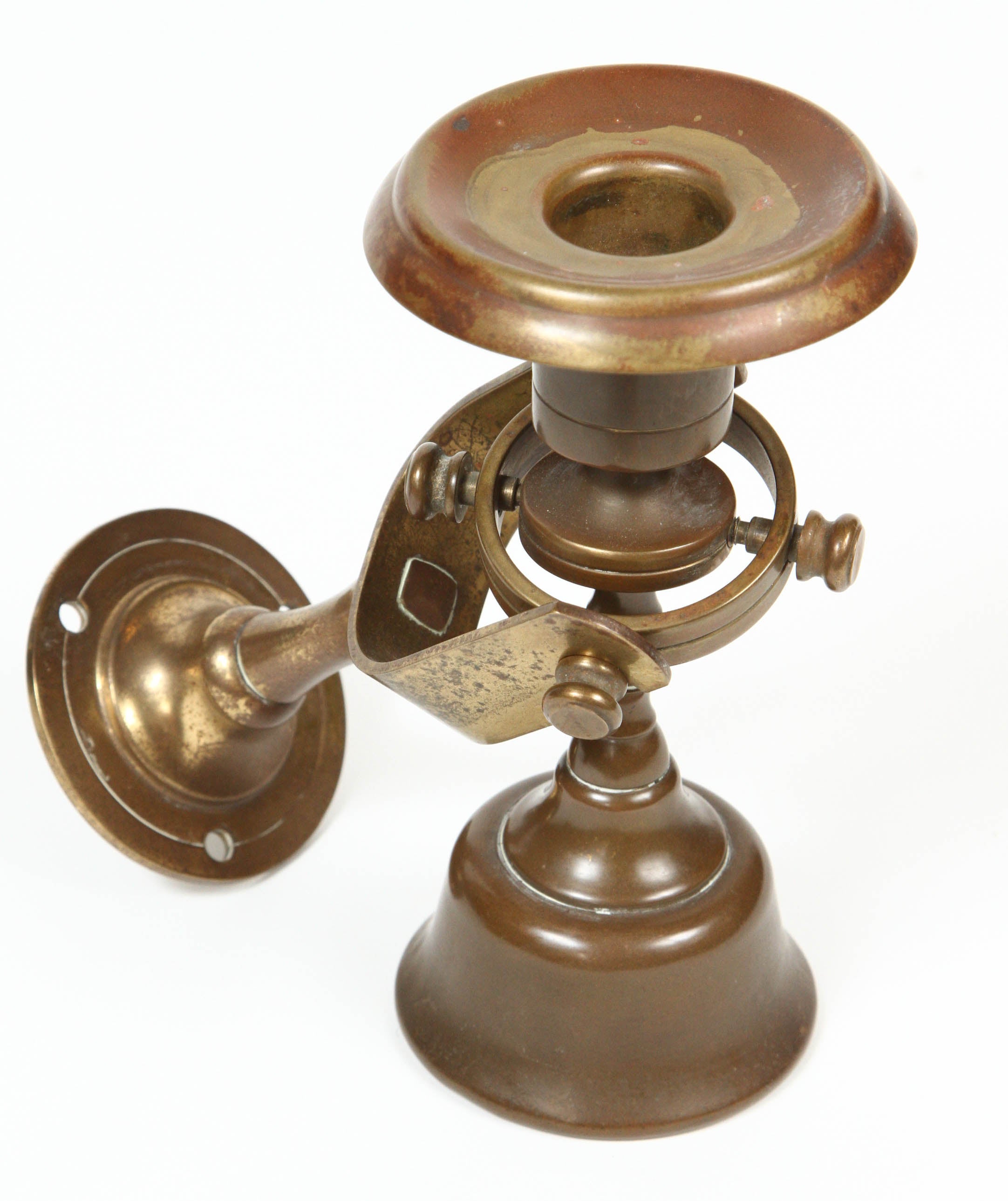 1920s weighted ship candleholders with gimbal to be attached to a wall.
Candlestick sits in gimbal and is meant to sway with ship movement.
Made in USA.
Bottom stamped 