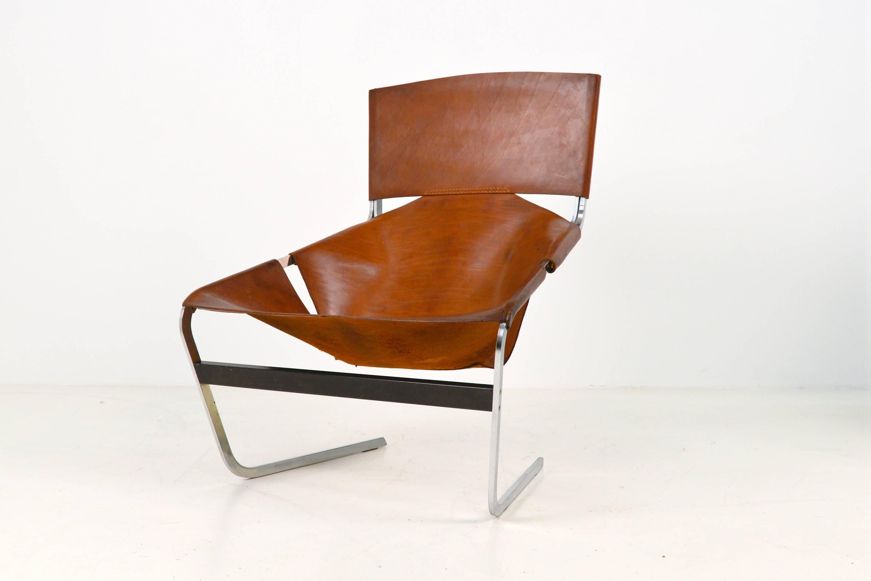 Artifort F444, Pierre Paulin lounge chair.
Pierre Paulin designed this chair in 1963 for Artifort.
This chair has been produced circa 1968!
Solid steel frame with a saddle leather sling seat.
This example is in a well preserved original