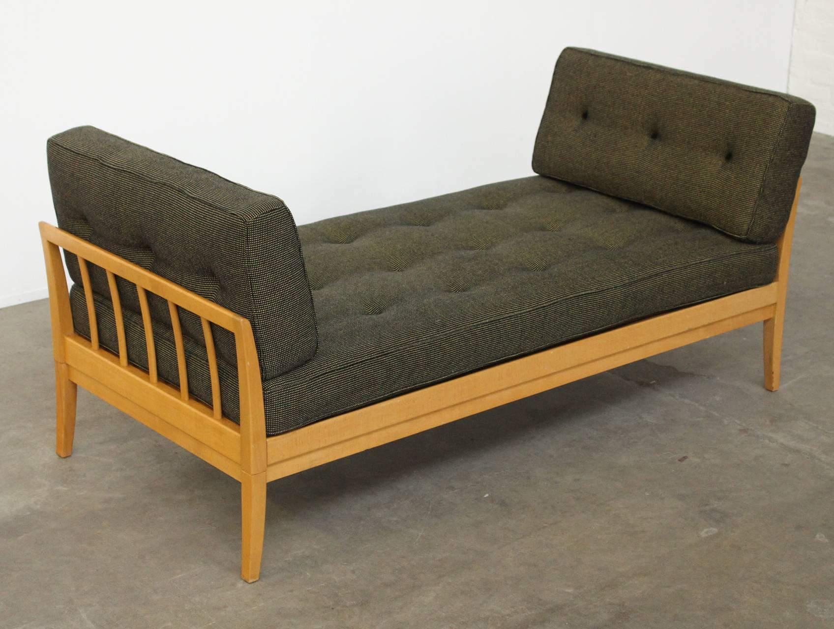 Very rare wonderful birch wood daybed by Knoll, part of the Antimott range of furniture. The right armrest has a sliding mechanism and extends to 210cm (83 inches). The original tufted fabric cushions are in perfect condition and the wood is