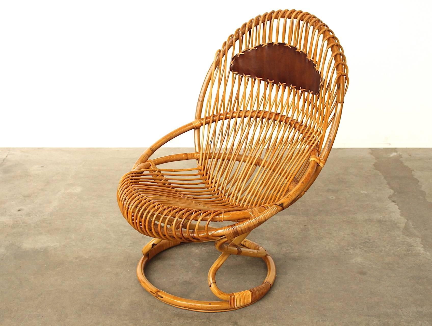 Extremely rare to find easy chair or armchair designed by Italian designer Giovanni Travasa for the design company Pierantonio Bonacina in the 1950s. The chair is beautifully master handcrafted with bent rattan strings and looks absolutely amazing