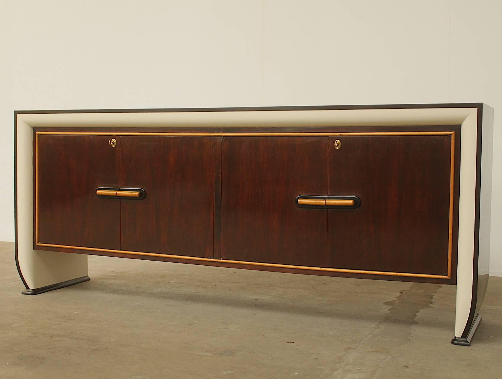 For all items from this dealer please hit the button VIEW ALL FROM SELLER below on this page

Very large sideboard by Italian designer Osvaldo Borsani. The combination of different types of wood create a colorful piece, distinctive for the Borsani