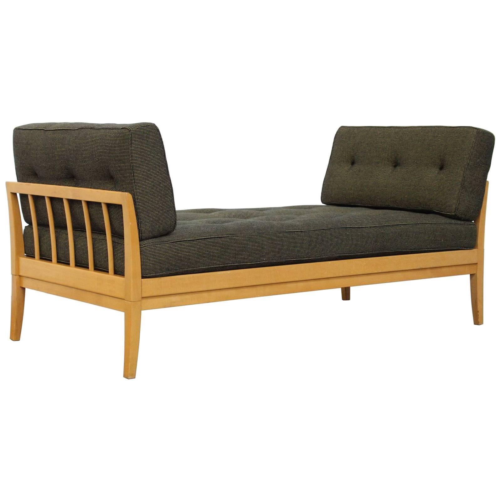 Very rare wonderful birch wood daybed by Knoll, part of the Antimott range of furniture. The right armrest has a sliding mechanism and extends to 210cm (83 inches). The original tufted fabric cushions are in perfect condition and the wood is