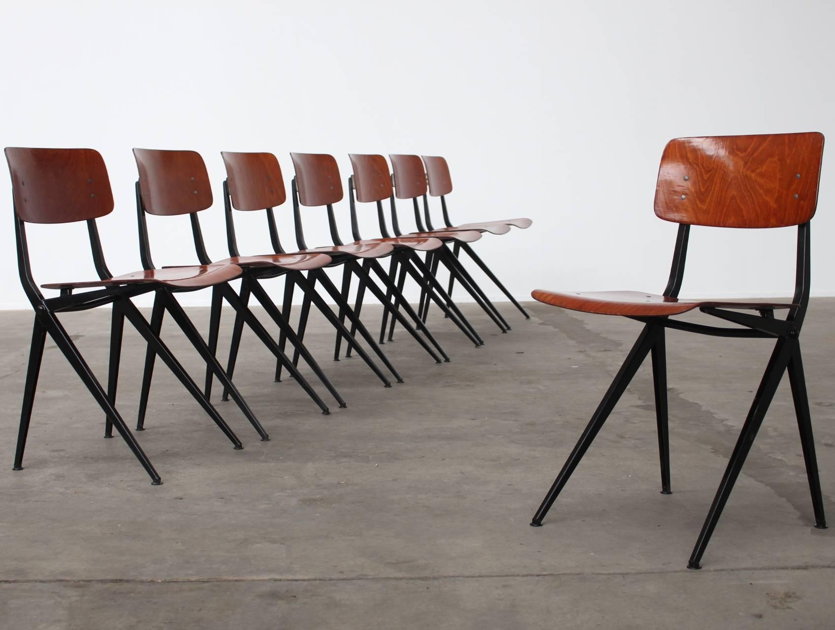 Set of eight stunning Industrial dining chairs by Dutch Industrial Design brand Marko. The steel frame has the elegant compass shape with a strong connection to the Industrial style of designs by Jean Prouvé and Gerrit Rietveld. This is the rarest