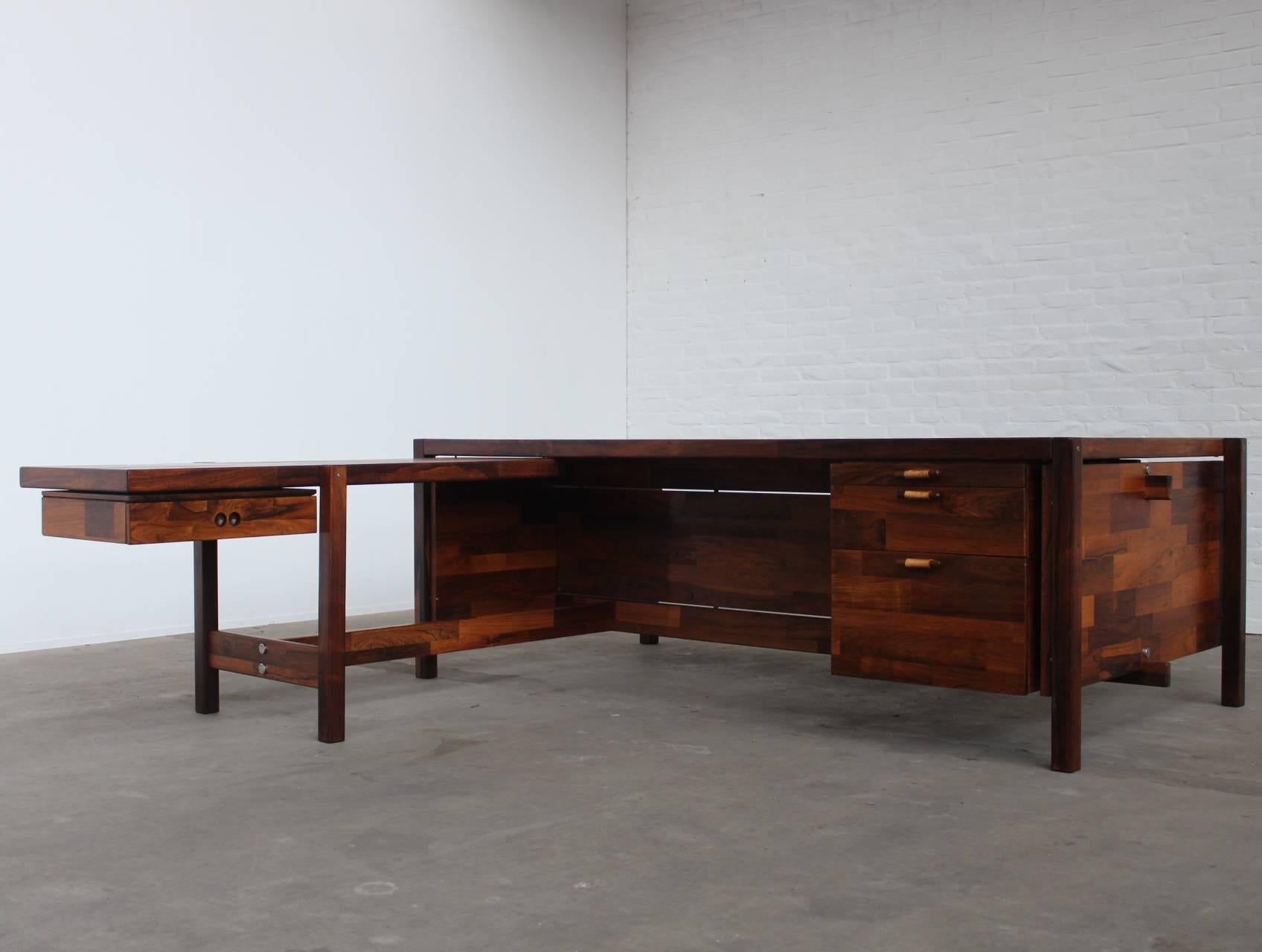 Astonishing large executive desk with return by the Brazilian designer Jorge Zalszupin manufactured by L'Atelier, São Paulo Brazil. Made out of the best selected rosewood / jacaranda veneer parts in combination with solid rosewood and has the