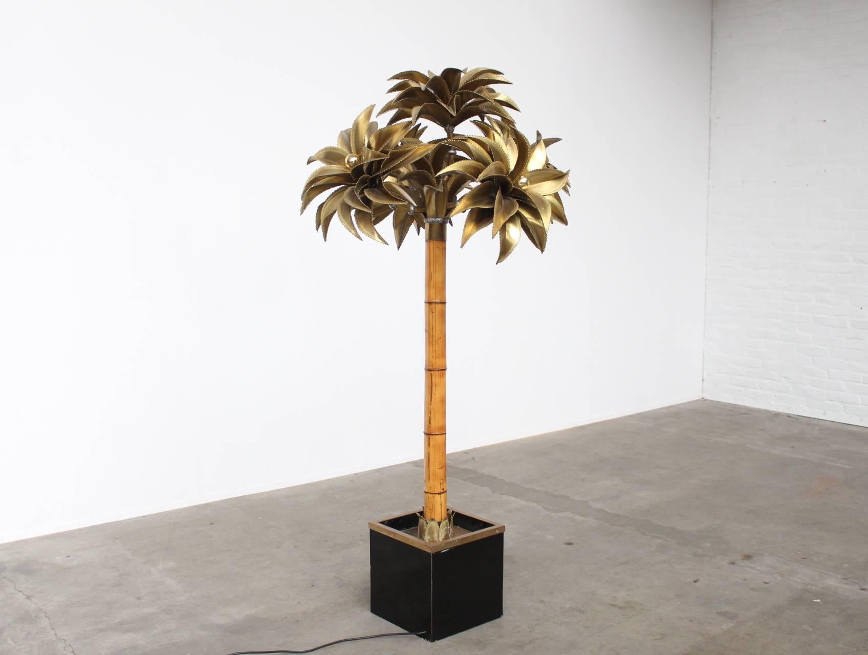 Exceptional palm tree floorlamp with 5 large copper clusters of leafs and flowers lit by 6 light sources. This is one of the first editions of palm tree floor lamps which the ditinctive bamboo trunk.