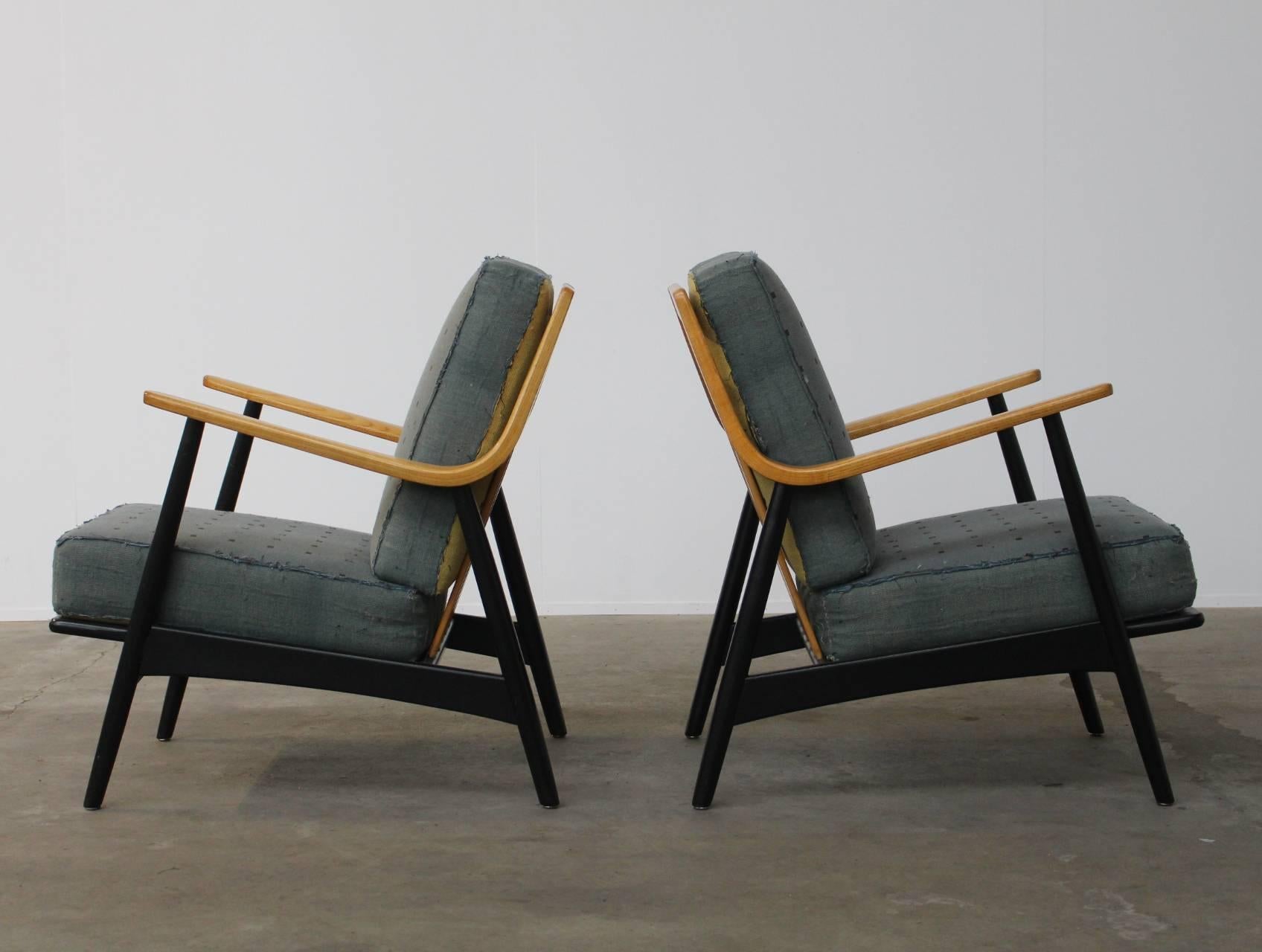 Beautifully sculpted and very rare easy or lounge chairs by Peter Hvidt and Orla Mølgaard-Nielsen manufactured in the 1950s by France and Daverkosen, Denmark. The coil spring cushions have their original 1950s upholstey; which can be used as the