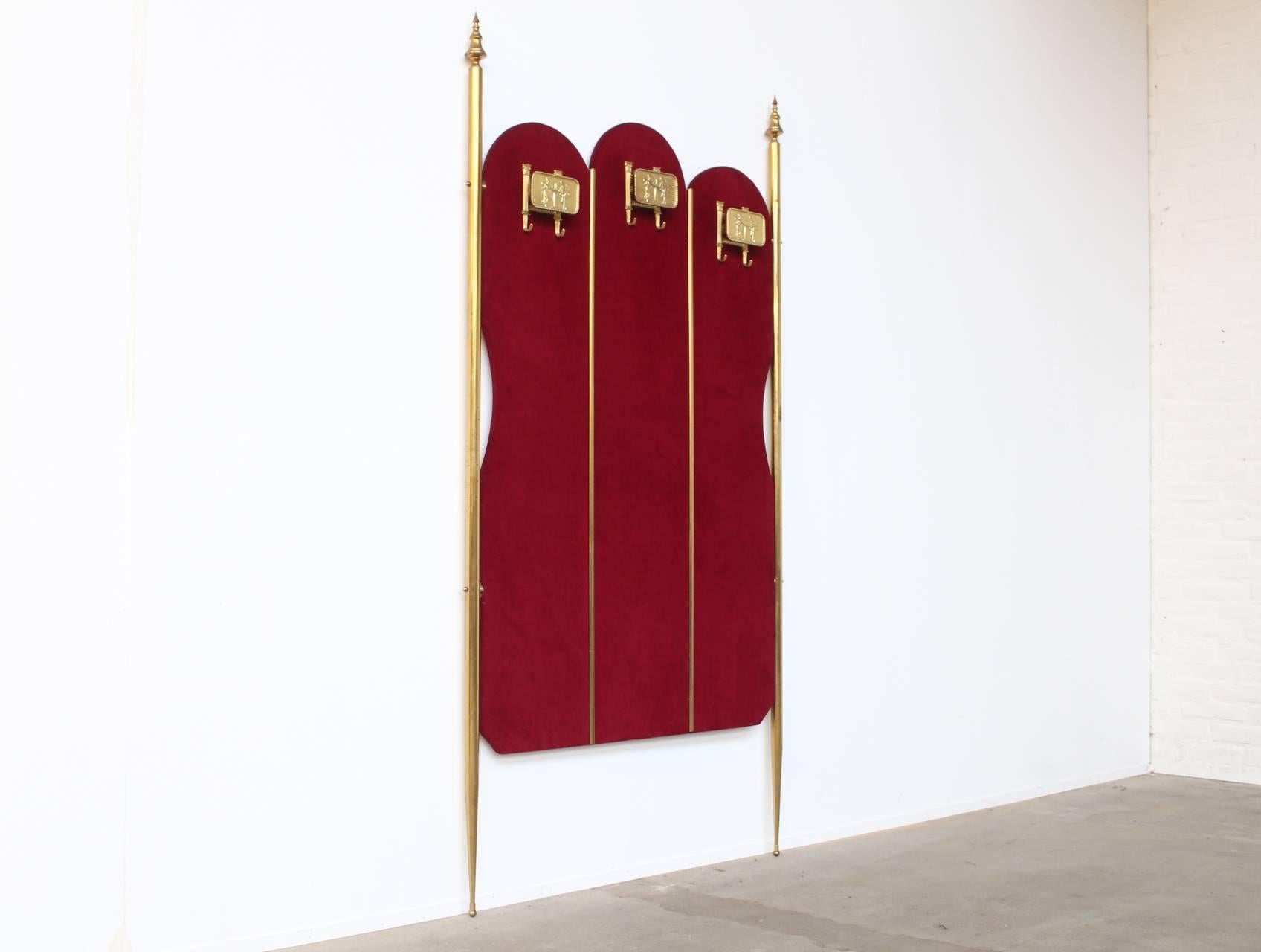 Amazing garderobe piece made of red plush velvet covered wood and brass stands and hardware. Fit to hang six coats.