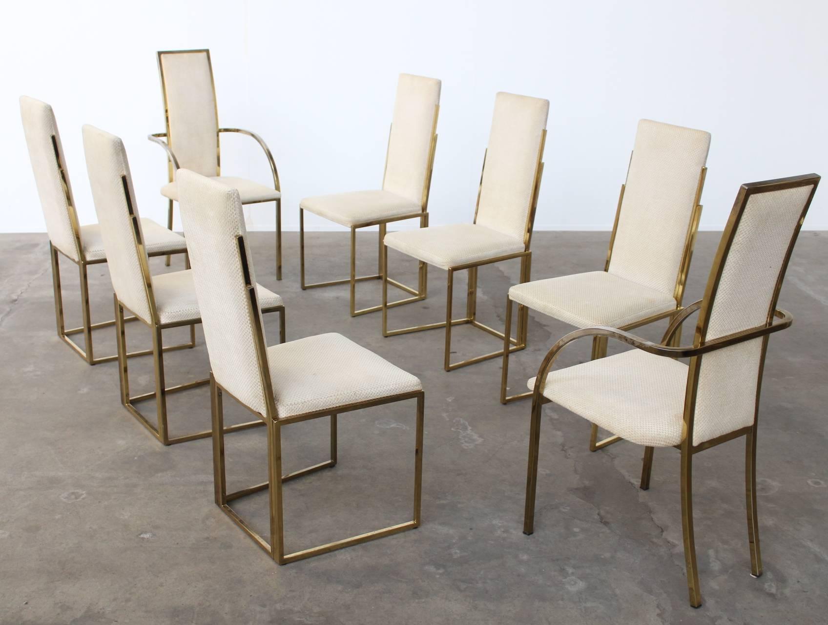 Very exclusive and beautifully crafted set of 8 dining chairs by Romeo Rega. The textured natural chenille upholstery feels very soft and smooth and is in great condition, an ultimate example of the Hollywood regency style and a true eye catcher.