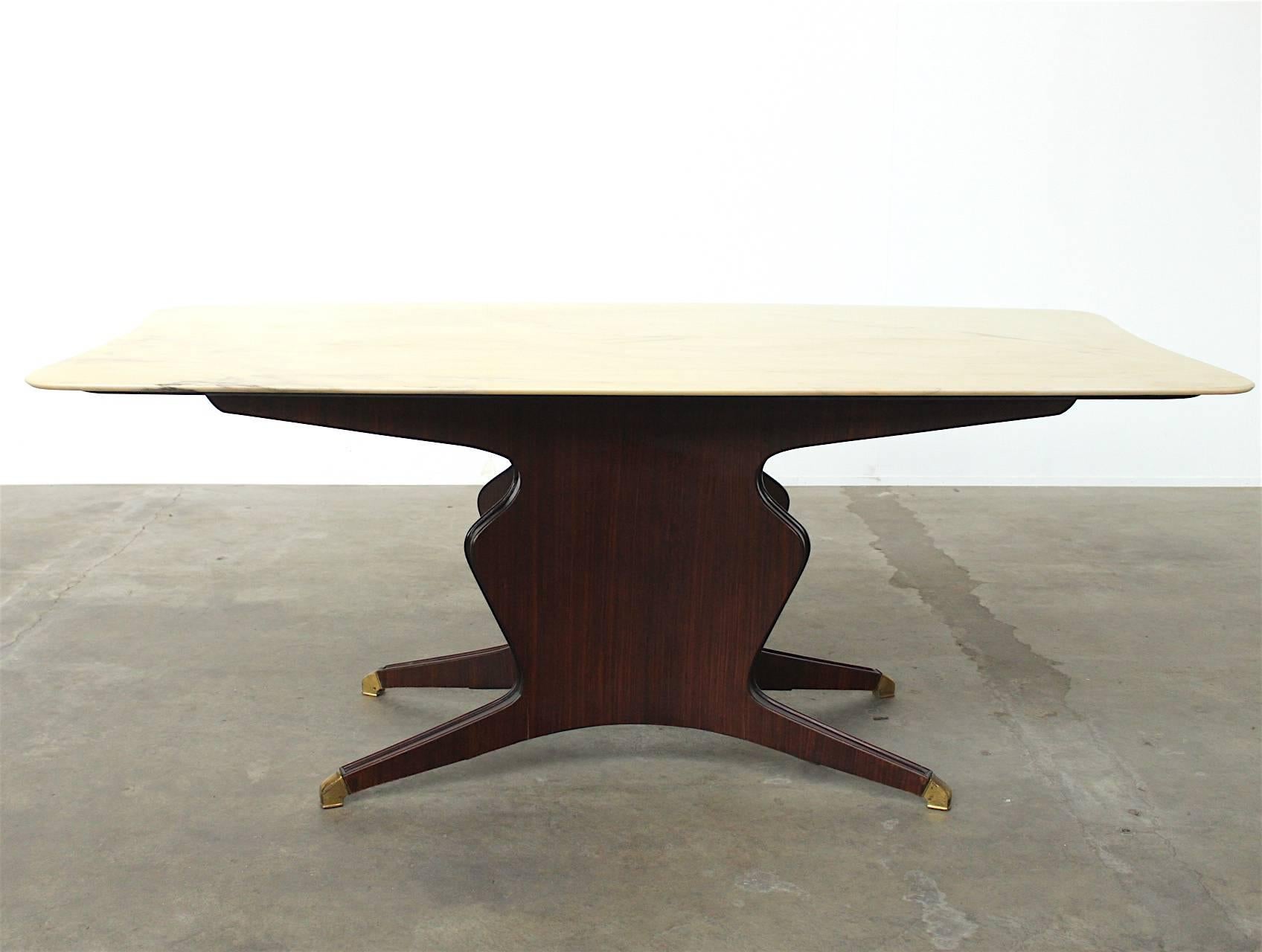 Stunning dining table for eight in the style Osvaldo Borsani with a beautiful organically shaped pedestal finished with copper leg tips and a multi coloured veined onyx tabletop.
This is a truly master crafted piece, notice the distinctive shape of
