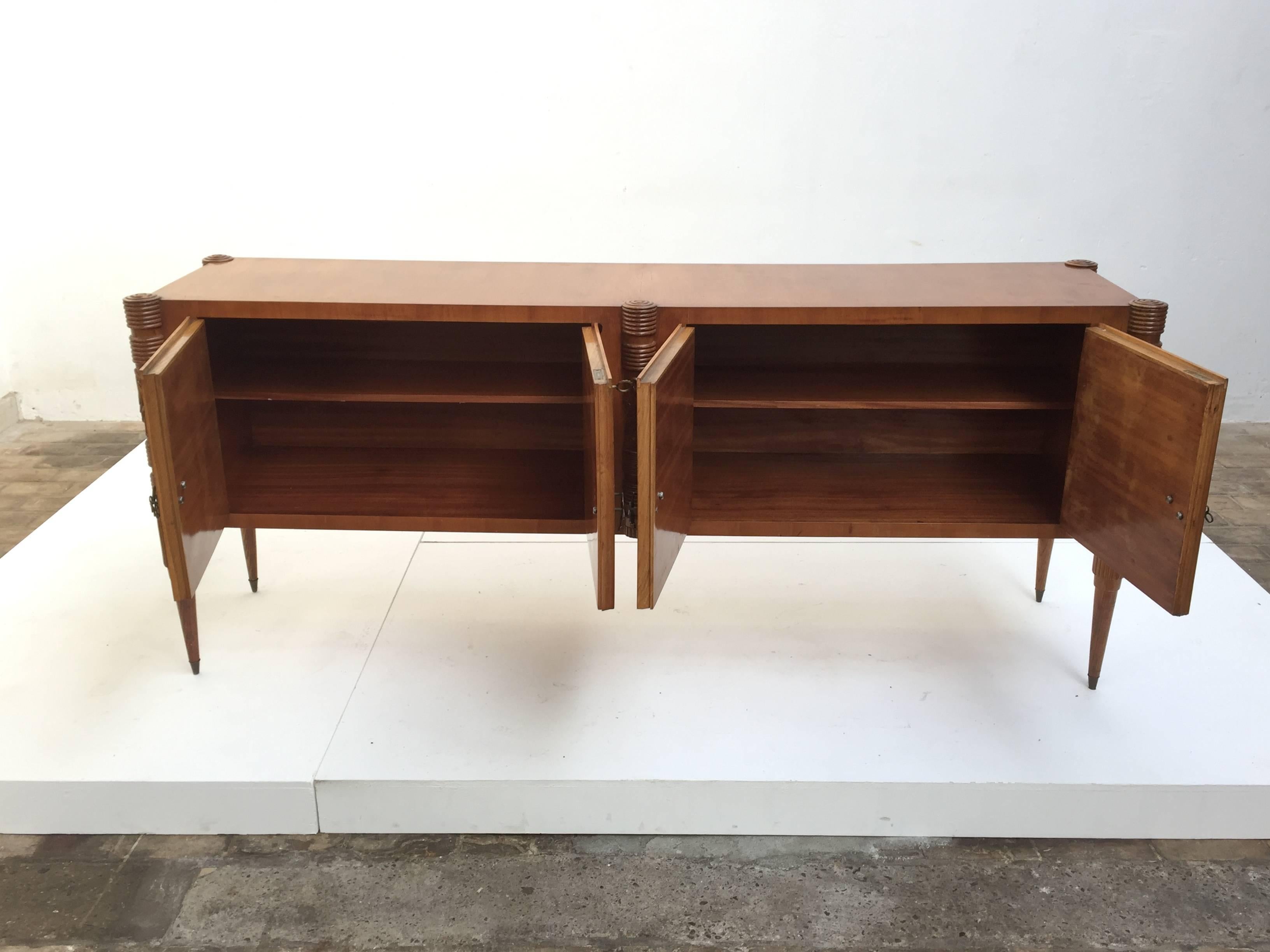 Beautiful four-door credenza by Pier Luigi Colli, manufactured by the famed 'Fratelli Marelli' atelier in Cantu, Italy, circa 1950. This credenza is finished in maple wood in addition to stunning burl maple wood veneer with intricately carved