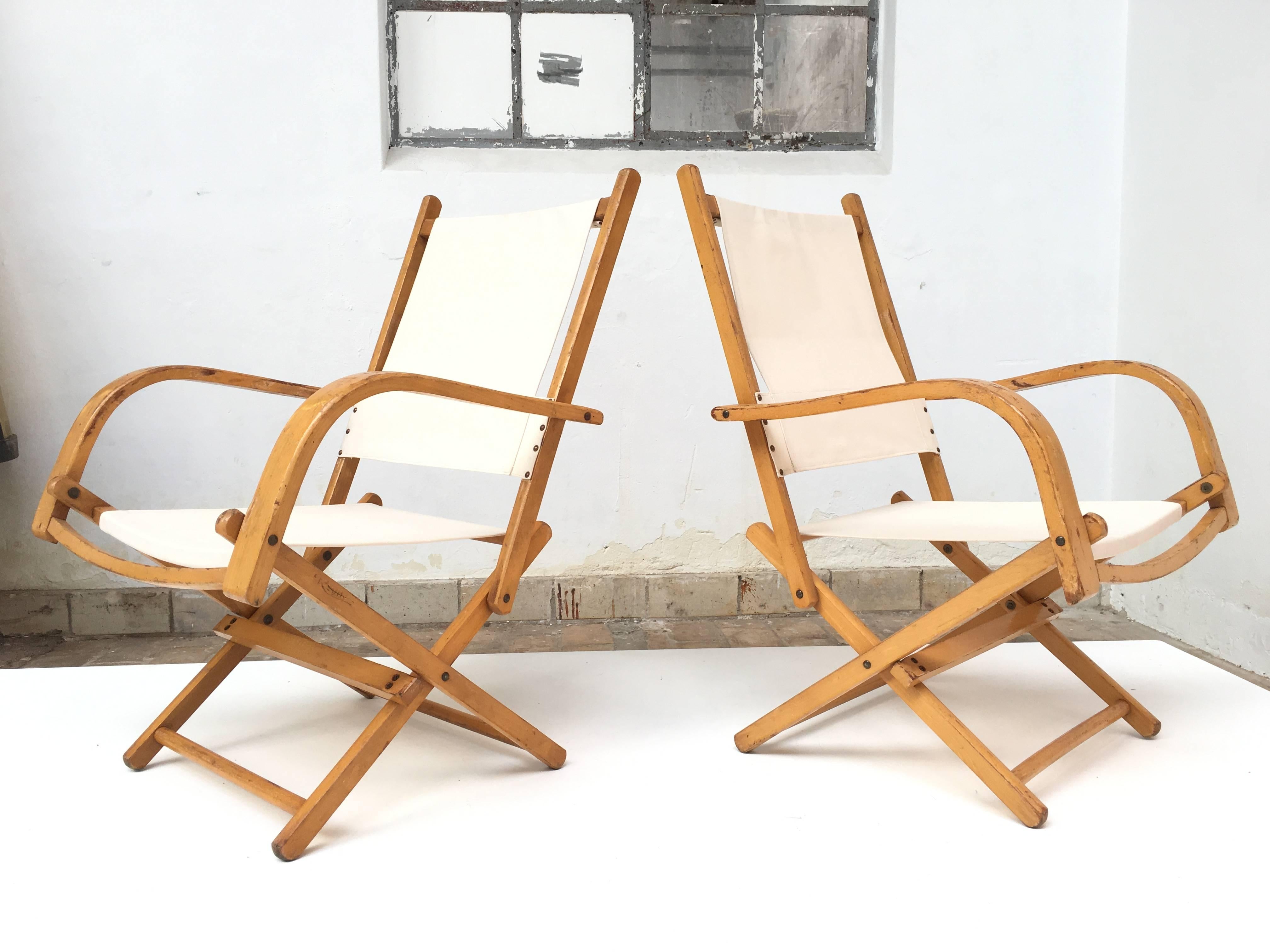 Lovely set of 4 mid century modern garden chairs with solid birch bend armrests   and new natural canvas

We replaced the old canvas with new but we left the birch frames as is with a characterful original vintage patinated look

Easy to store