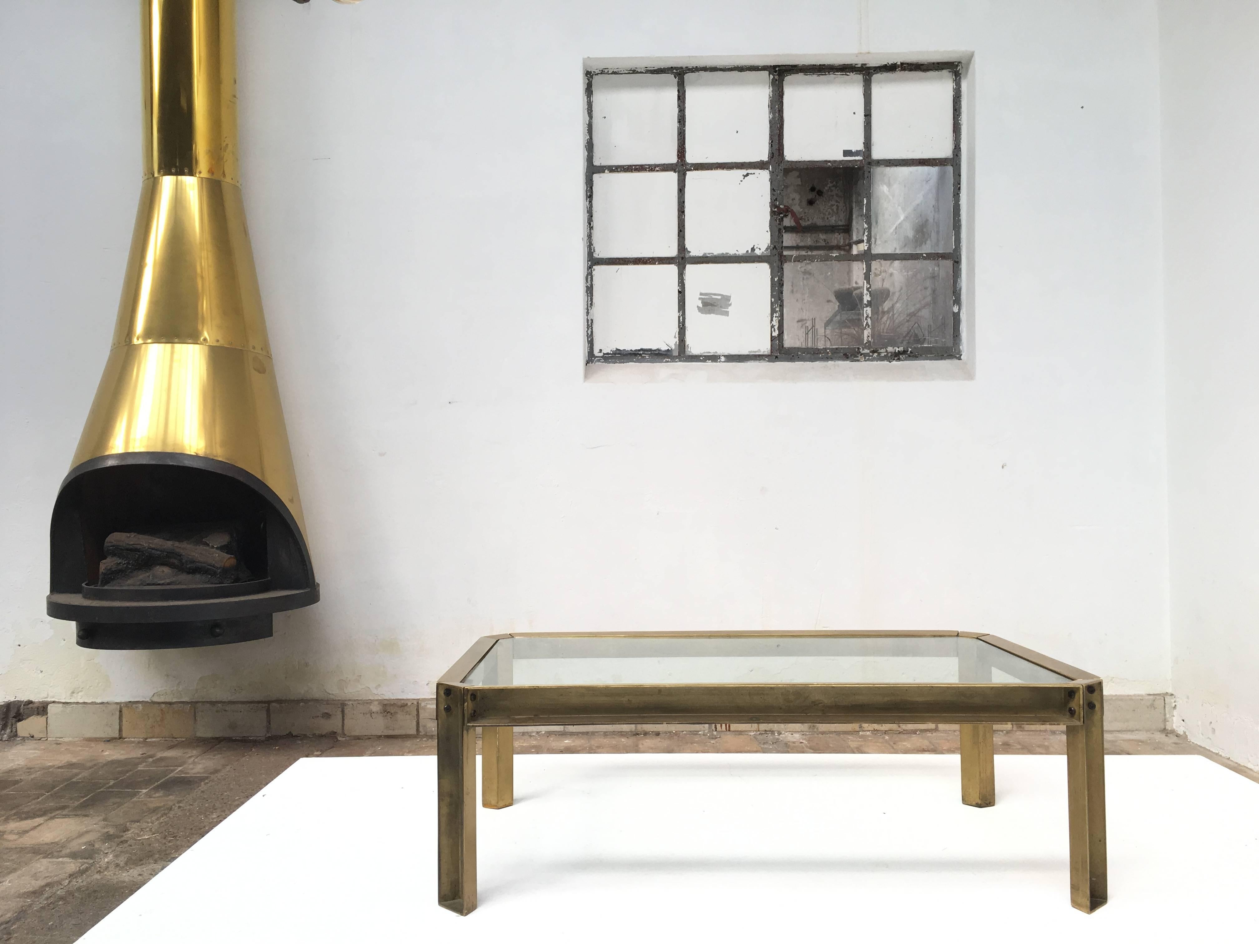 Rare coffee table by Dutch designer Peter Ghyczy.
Made from hand casted brass with a Brutalist unfinished exterior and polished sides and top.

The table frame can be totally disassembled for easy shipping.
