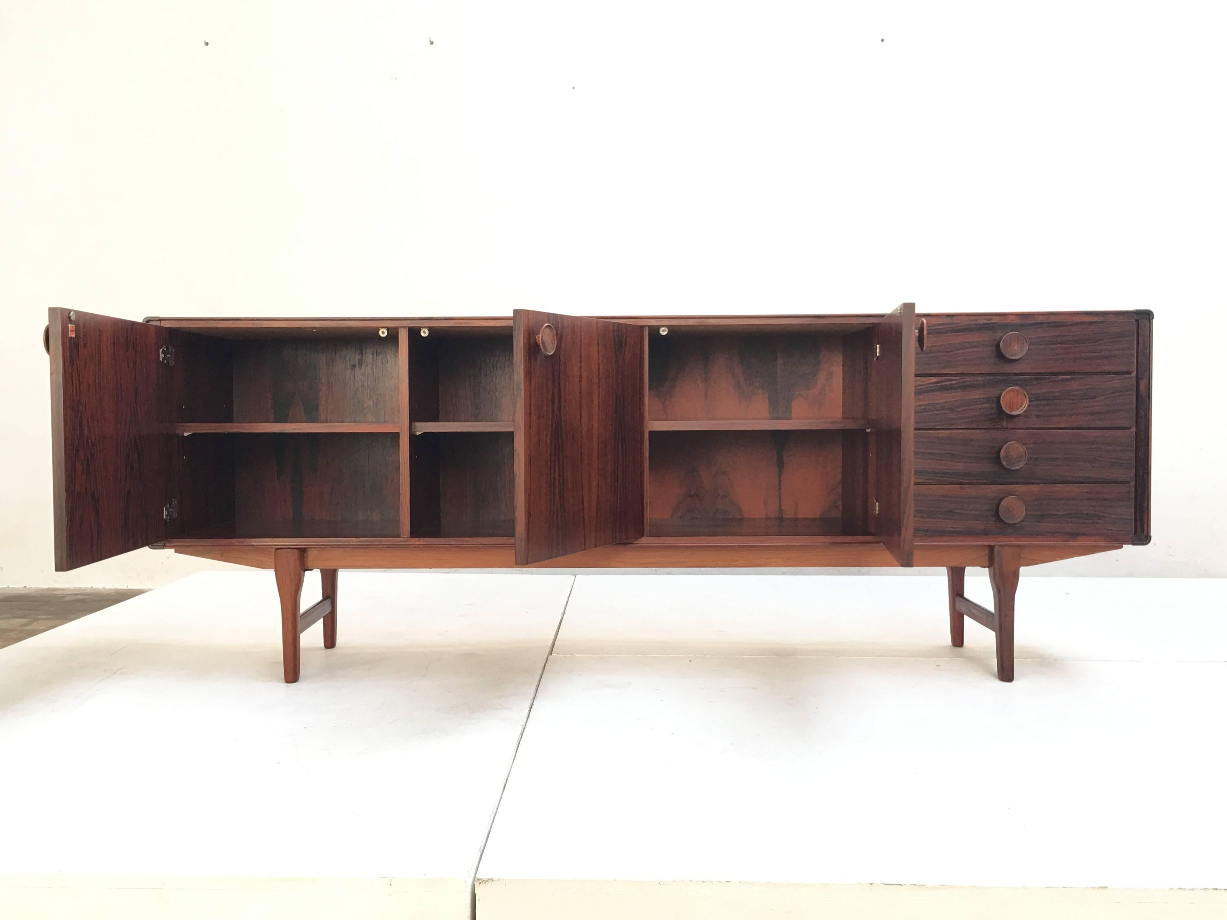 Beautiful 'FDT-1205' rosewood credenza designed by Dutch cabinetmaker Fristho Franeker in 1965. Signed with original Fristho enamel badge to the interior. The rare 'FDT-1205' cabinet is documented in the book 'Fristho vooruitstrevende meubelen