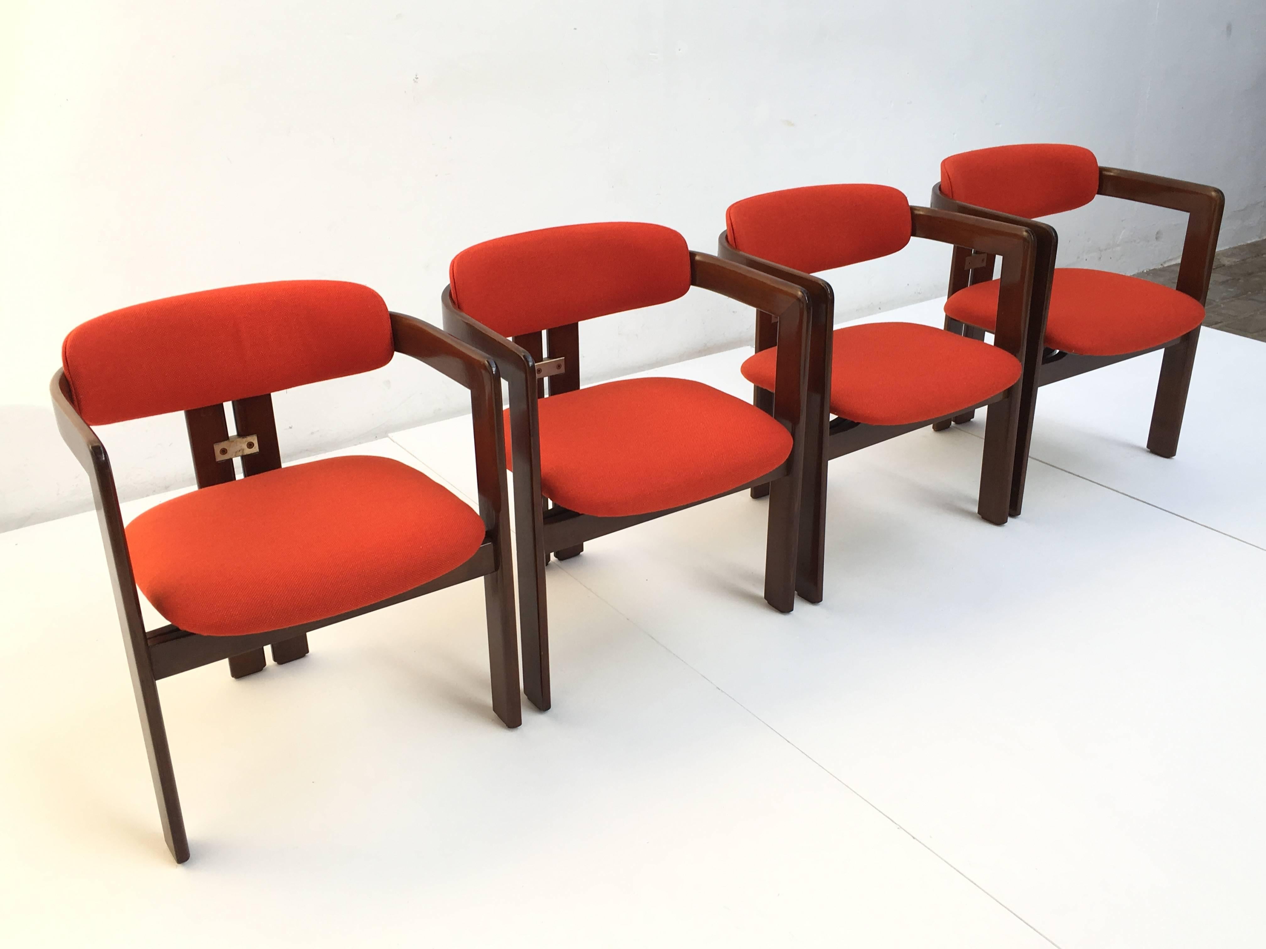 Superb set of four 'Pamplona' dining chairs finished in Italian walnut with wool seating by Italian master designer Augusto Savini for Pozzi, Italy, 1965.

The 'Pamplona 'chair has a refined sculptural form reminiscent of the elegant forms and