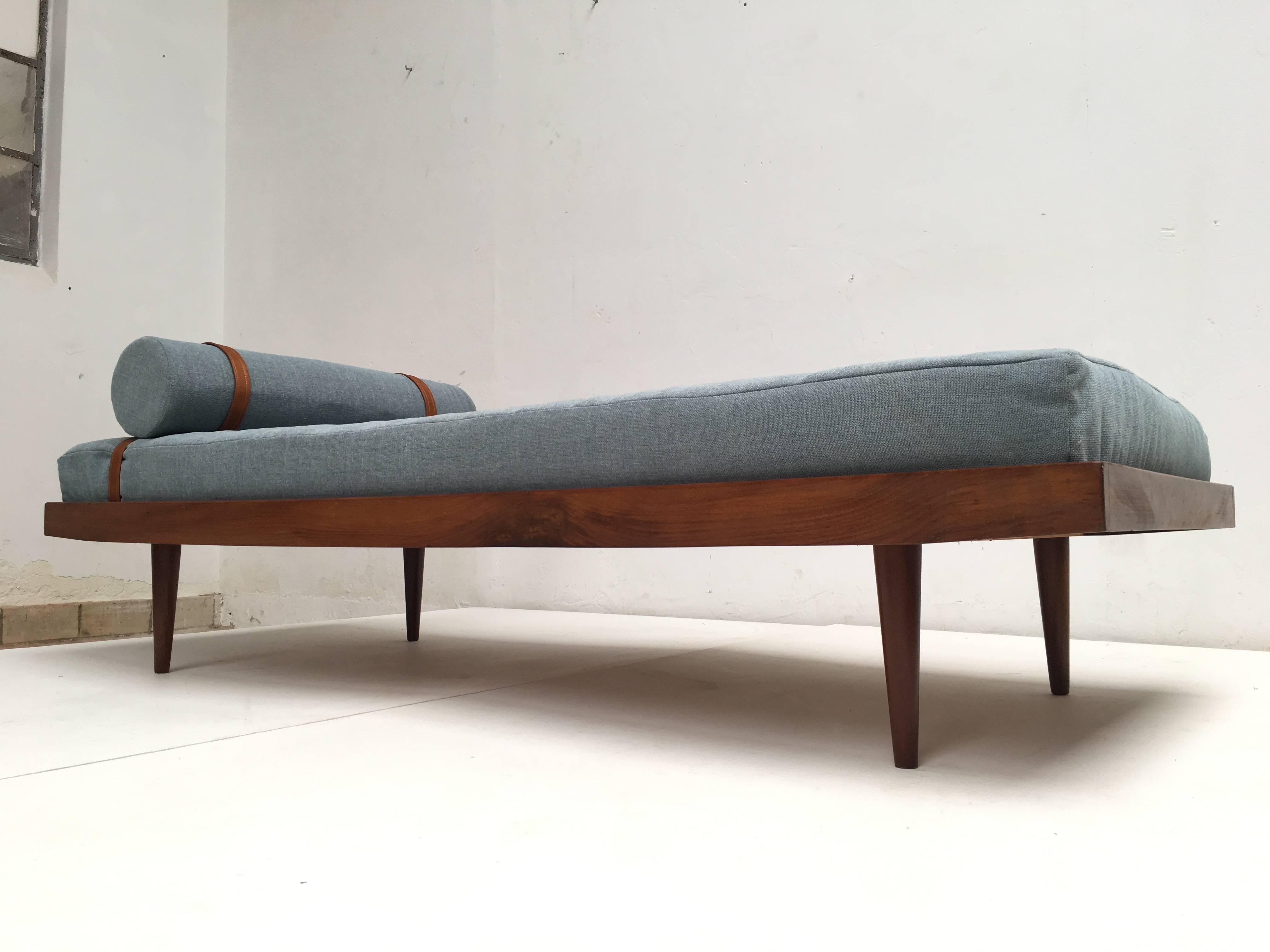 Scandinavian daybed in solid Teak wood with new upholstery

The mattress has Latex foam and we used light blue De Ploeg "Steppe" wool upholstery with a neck roll held by leather straps

Very comfortable for a quick daytime nap 