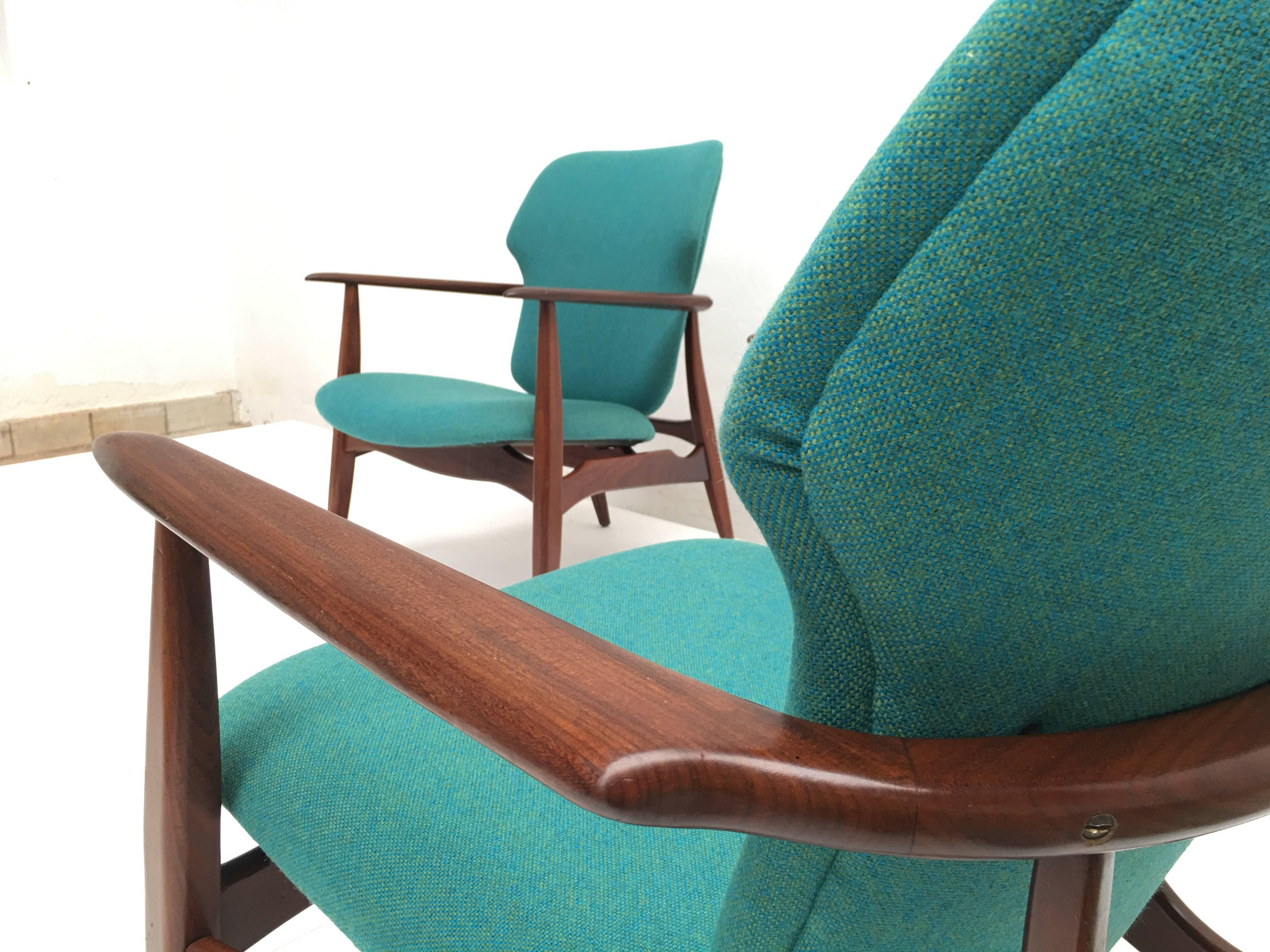 Stunning set of lounge chairs totally fully restored with new foam and De Ploeg Wool upholstery in a blue/green melange (see detail photo 7)

Design is by Aksel Bender Madsen and they were produced in Denmark to be distributed by Dutch firm
