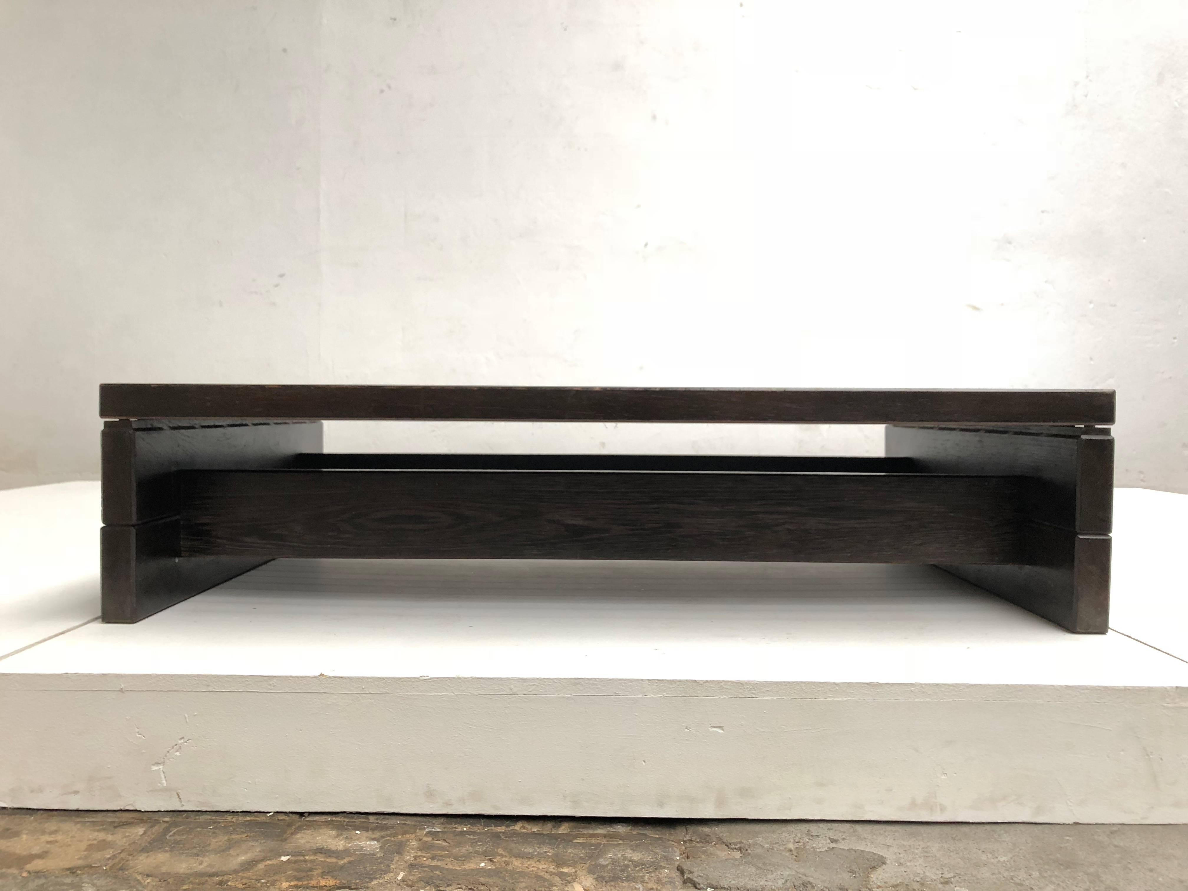 This high quality coffee table or low bench is made from very heavy solid wenge tropical hardwood

Most likely custom-made in the Netherlands during the 1960s when this type of wood was very popular in the Dutch interiors and furniture design,
