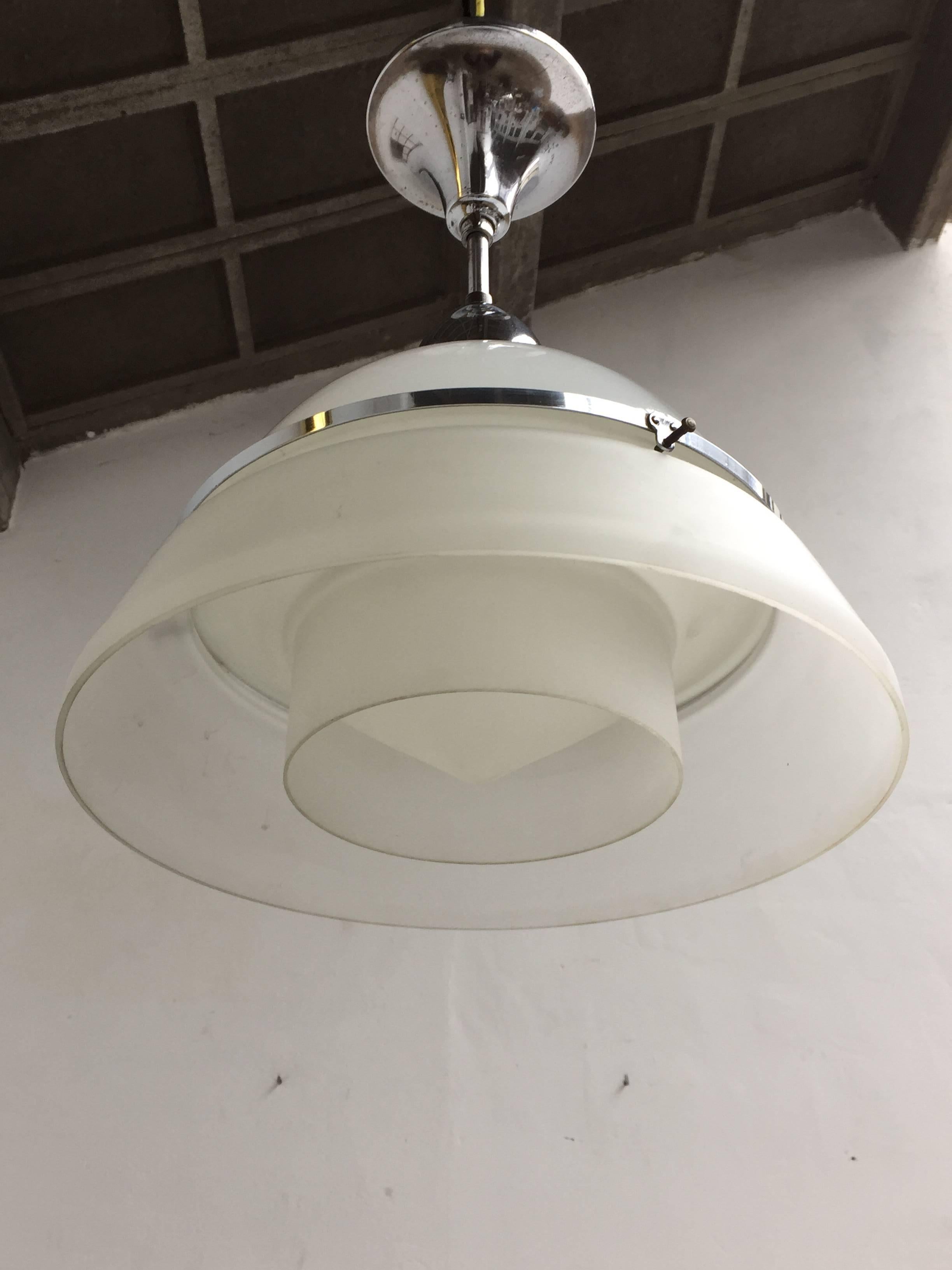 A beautiful original circa 1920s pendant lamp.

This lamp comes from the interior of an amazing Art Nouveau house that was build circa 1900 in Antwerp.

This Art Deco pendant is most likely of French origin and in the style of Georges