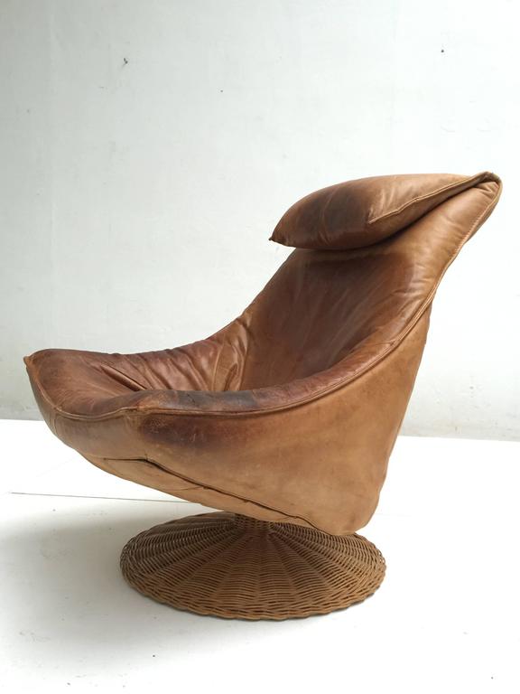 1970s Swivel easy chair by Dutch designer Gerard van den Berg for Montis

This chair has sturdy thick natural distressed neck leather that acquired a stunning and characterful patina over the years in use

Gerard van den Berg is known for his
