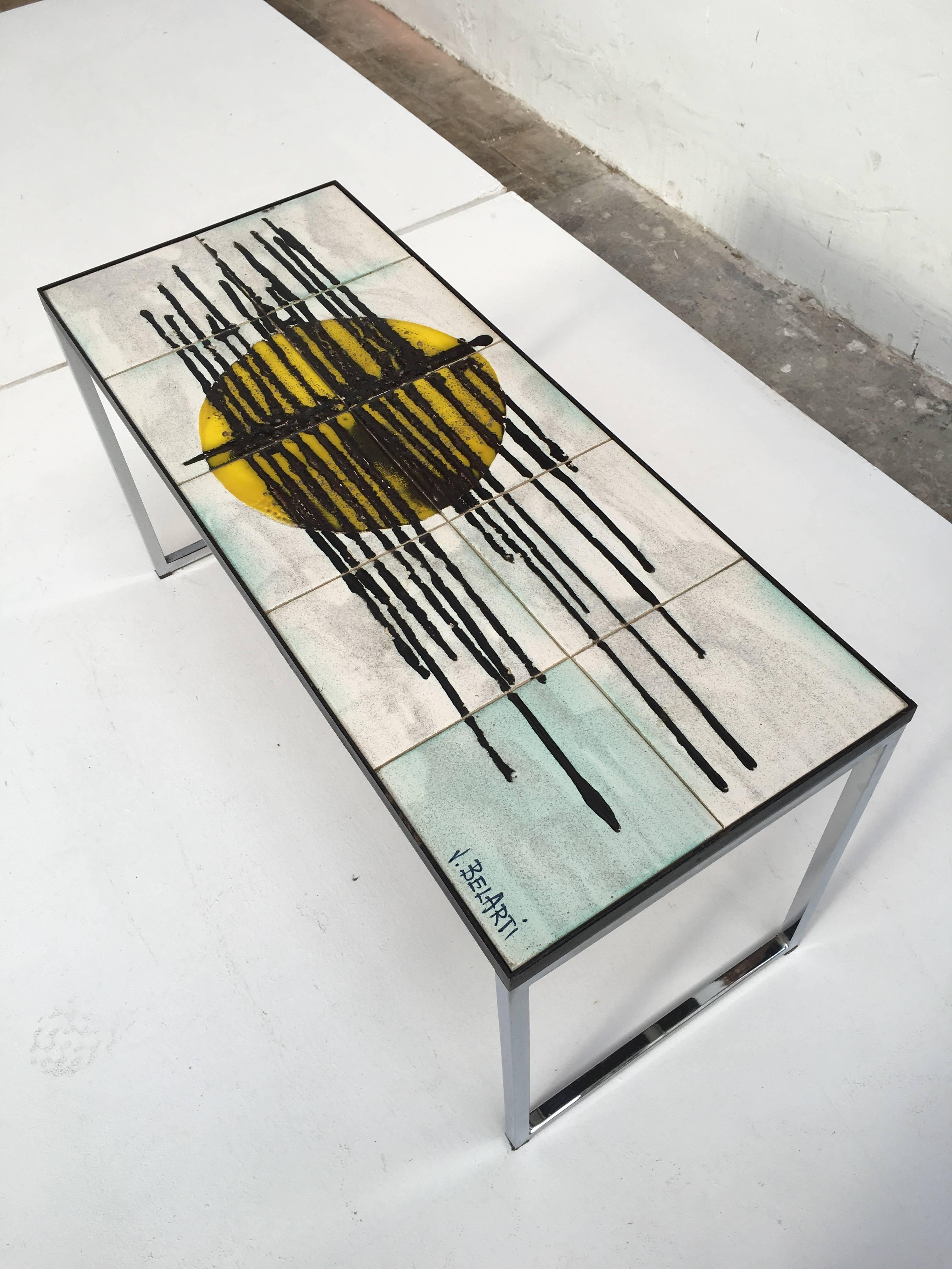 Signed Juliette Belarti abstract ceramic side/coffee table 

This small gem will be a real eye-catcher in your interior with its abstract mid century modern black, yellow and  cyan blue handpainted ceramic tile top

