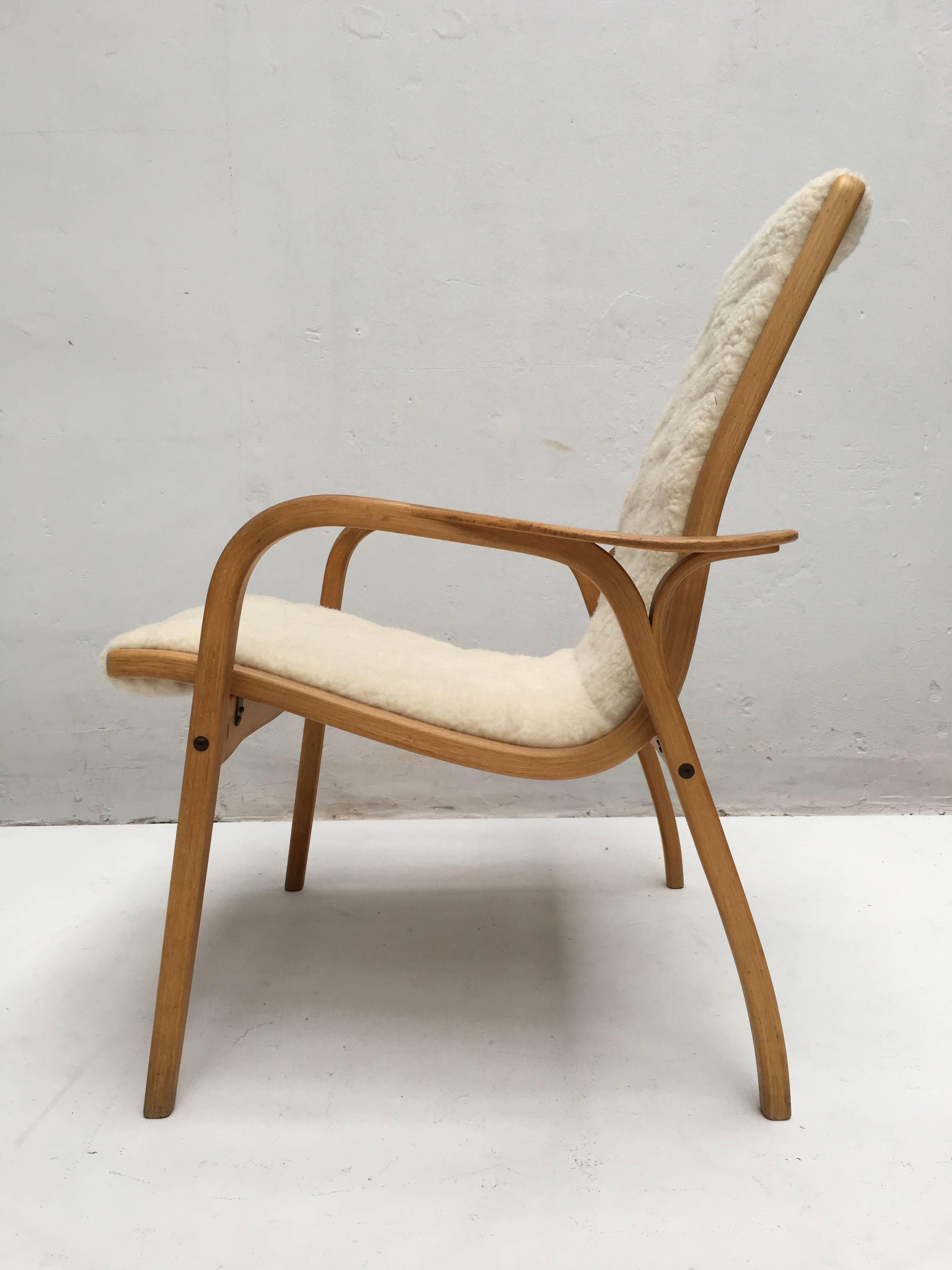 A lowback Lamino chair by Swedish designer Yngve Ekström for Swedese.

The original design for this famous chair was in 1956.

Laminated and bend birch plywood frame. 

This example is of later production, most likely late 1970s and has new